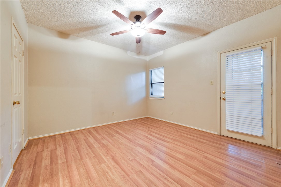 706 West 22nd Street, Unit 202 Austin, TX 78705 - Photo 10 of 24 a view of an empty room with wooden floor and a window