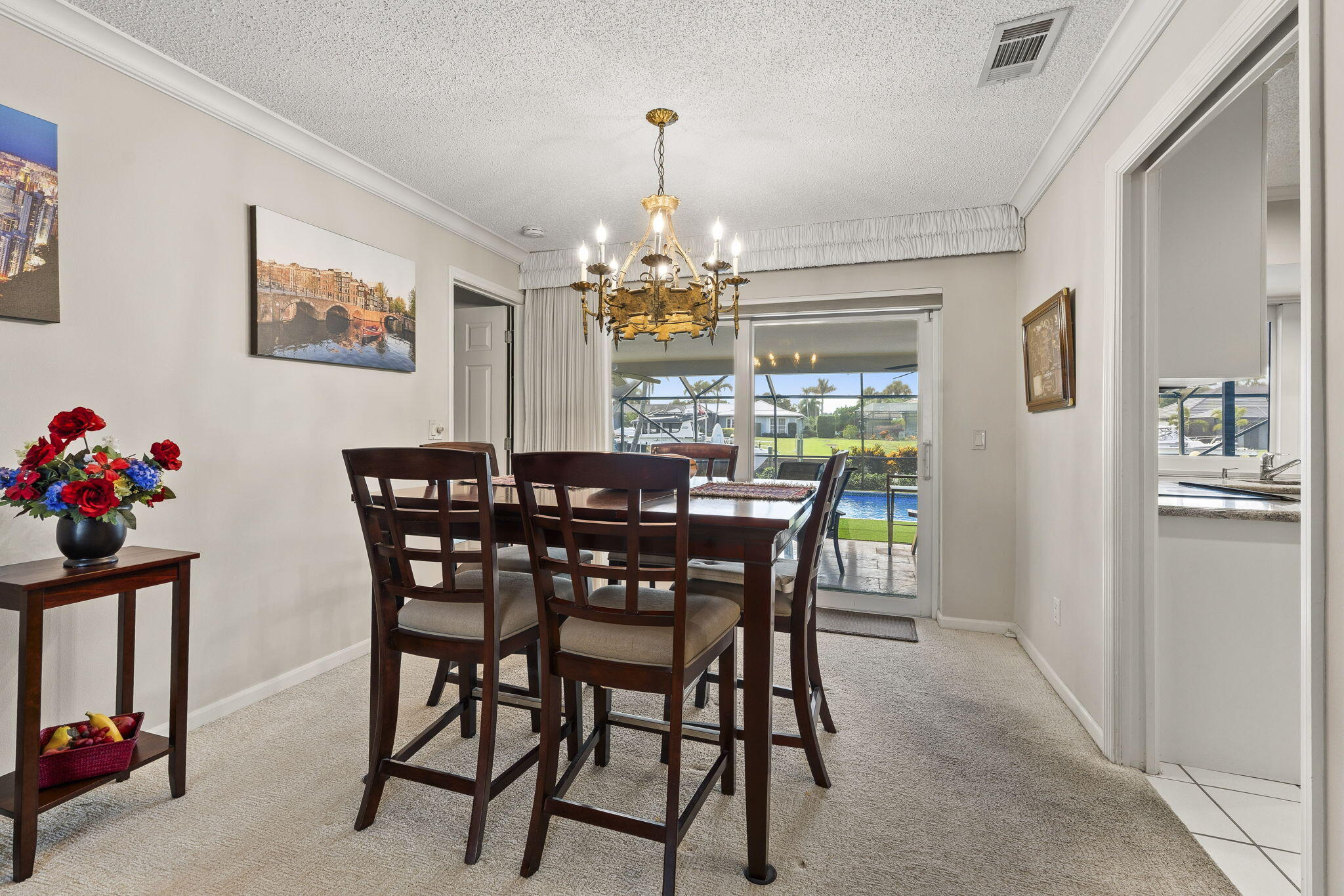 3374 Southeast Fairway East Stuart, FL 34997 - Photo 14 of 65 a view of a dining room with furniture window and chandelier