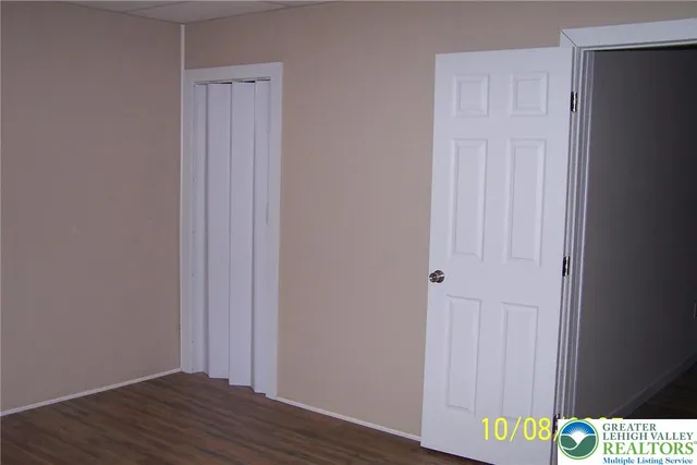 a view of an entryway with wooden floor