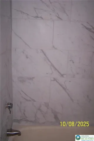 a close view of a shower in the bathroom