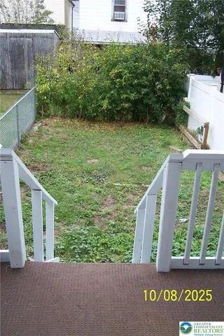a view of a garden from a balcony