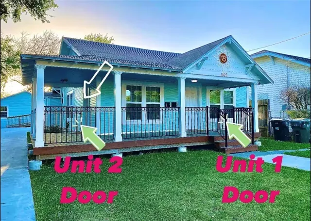 a front view of house with yard and slide