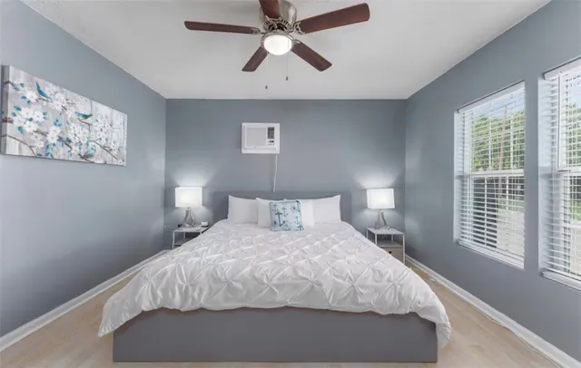 a bedroom with a bed and window