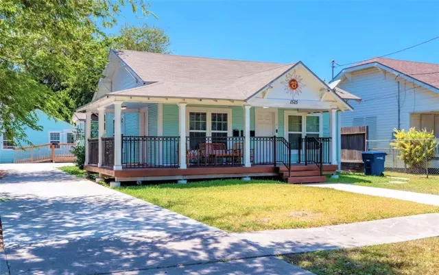 a view of a house with swimming pool and porch