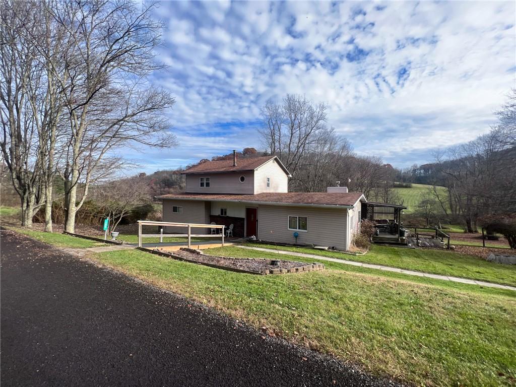 140 Fox Road Apollo, PA 15613 - Photo 3 of 24 a view of a house with a yard and sitting area