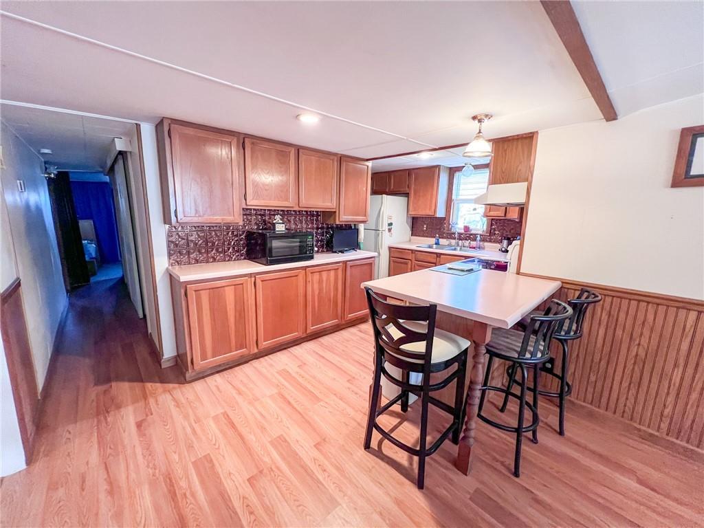 140 Fox Road Apollo, PA 15613 - Photo 5 of 24 a kitchen with stainless steel appliances a dining table chairs and wooden floor