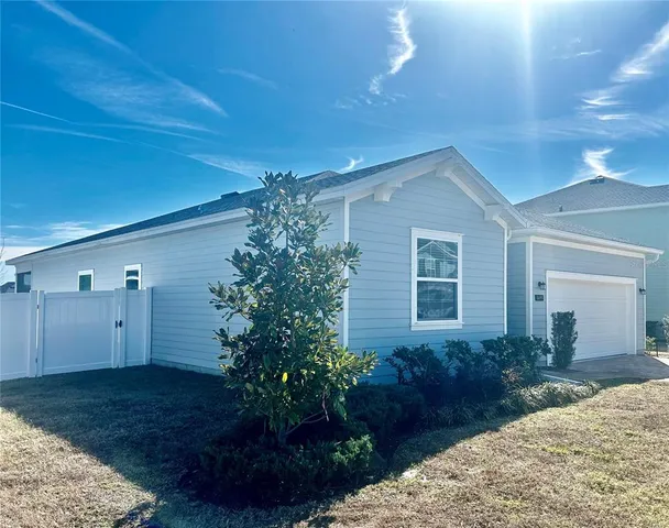 a house view with a backyard space