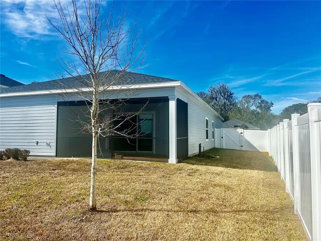 a house with trees in the background