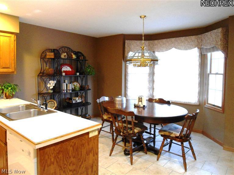 5761 Fenn Road Medina, OH 44256 - Photo 6 of 22 The bay window eating area in the Kitchen is bright with natural light from the three windows.