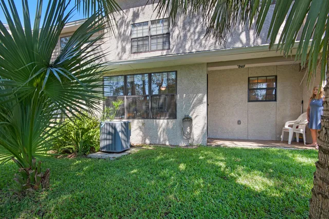 a view of a backyard with large trees