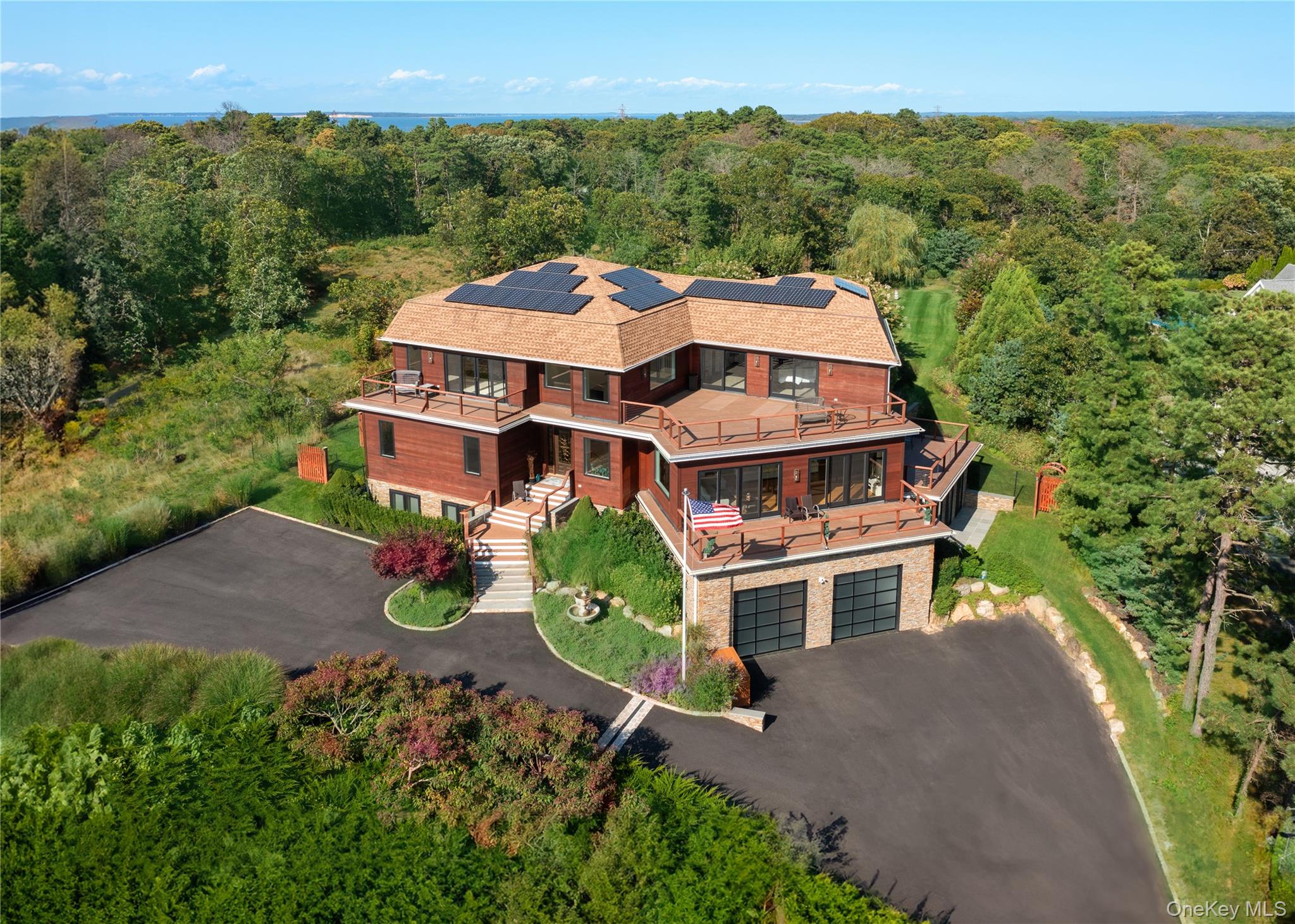 89 Old Canoe Place Road Hampton Bays, NY 11946 - Photo 10 of 39 Bird's eye view with a wooded view