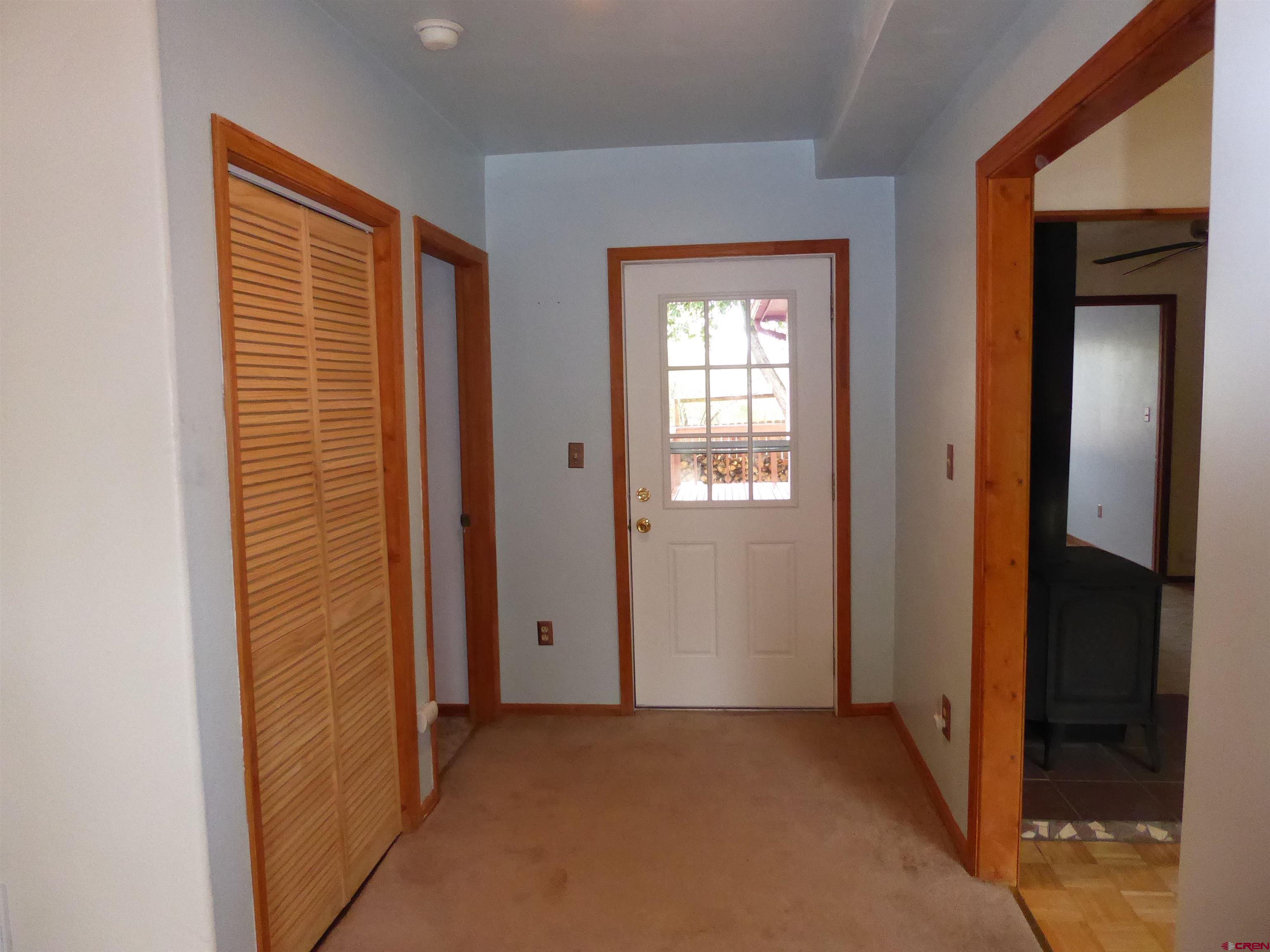 180 Northwest 7th Street Cedaredge, CO 81413 - Photo 15 of 44 an empty room with windows