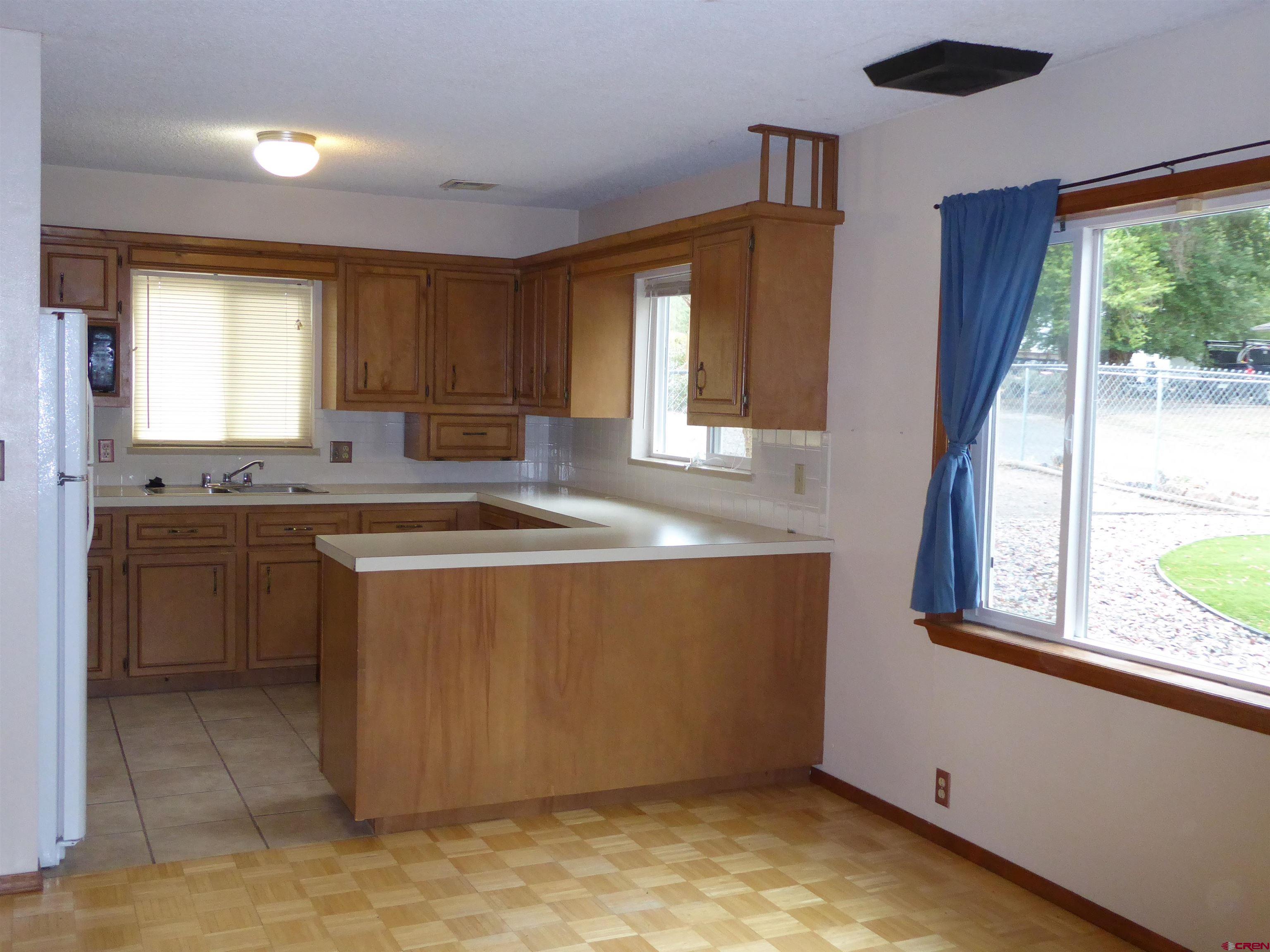 180 Northwest 7th Street Cedaredge, CO 81413 - Photo 25 of 44 a view of kitchen with granite countertop sink and cabinets
