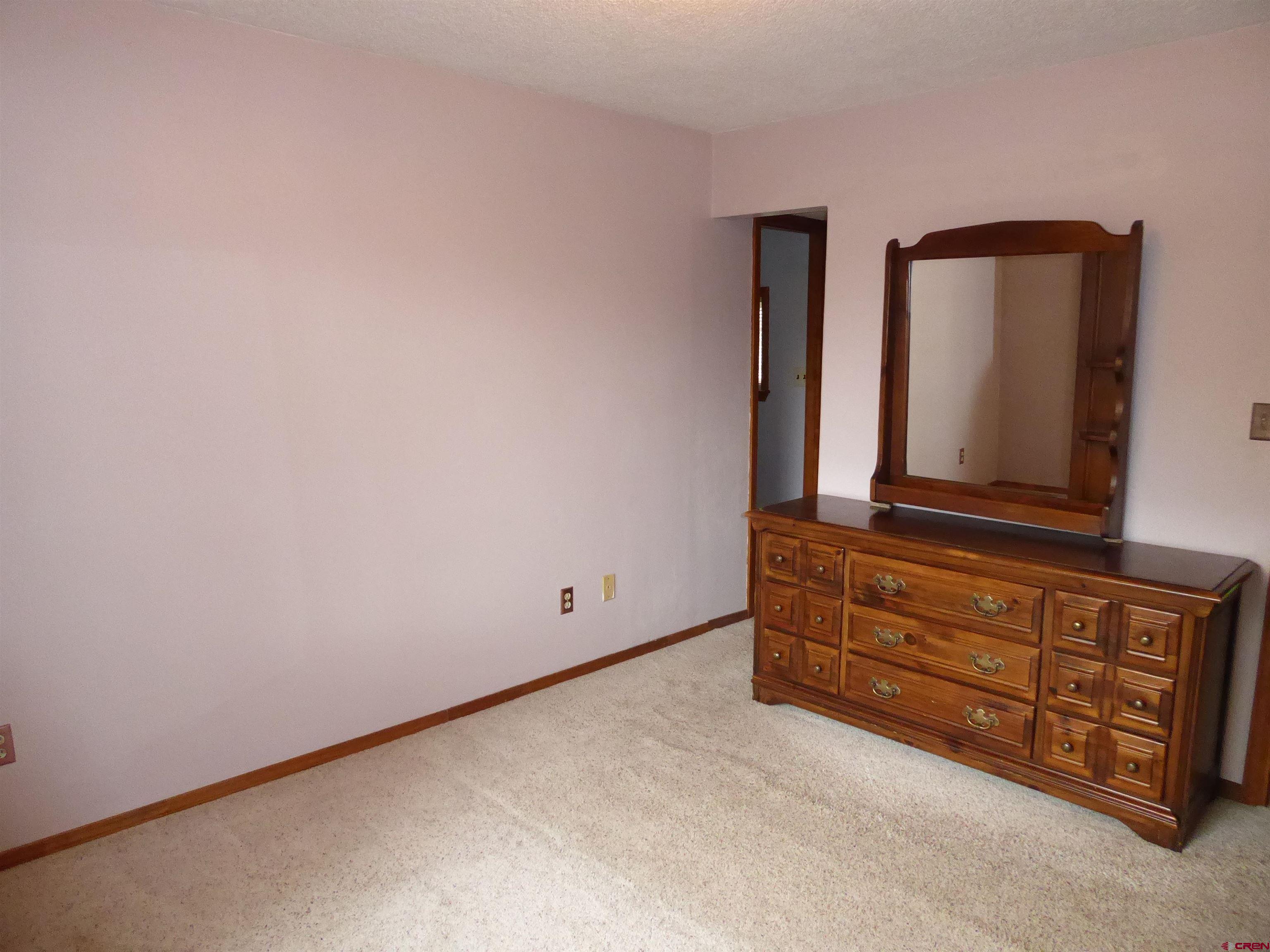 180 Northwest 7th Street Cedaredge, CO 81413 - Photo 32 of 44 a view of a dresser with mirror