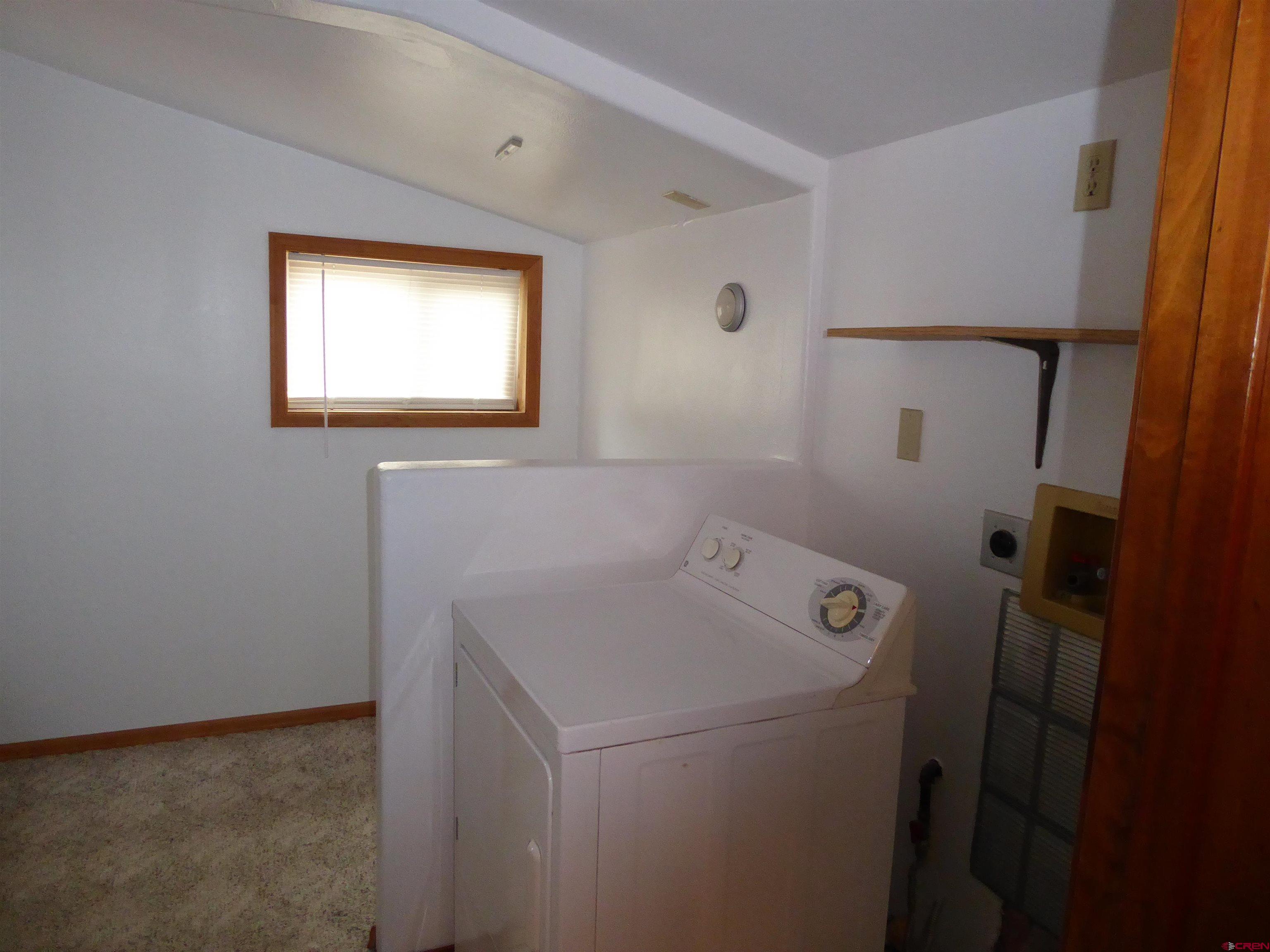 180 Northwest 7th Street Cedaredge, CO 81413 - Photo 36 of 44 a utility room with dryer and washer
