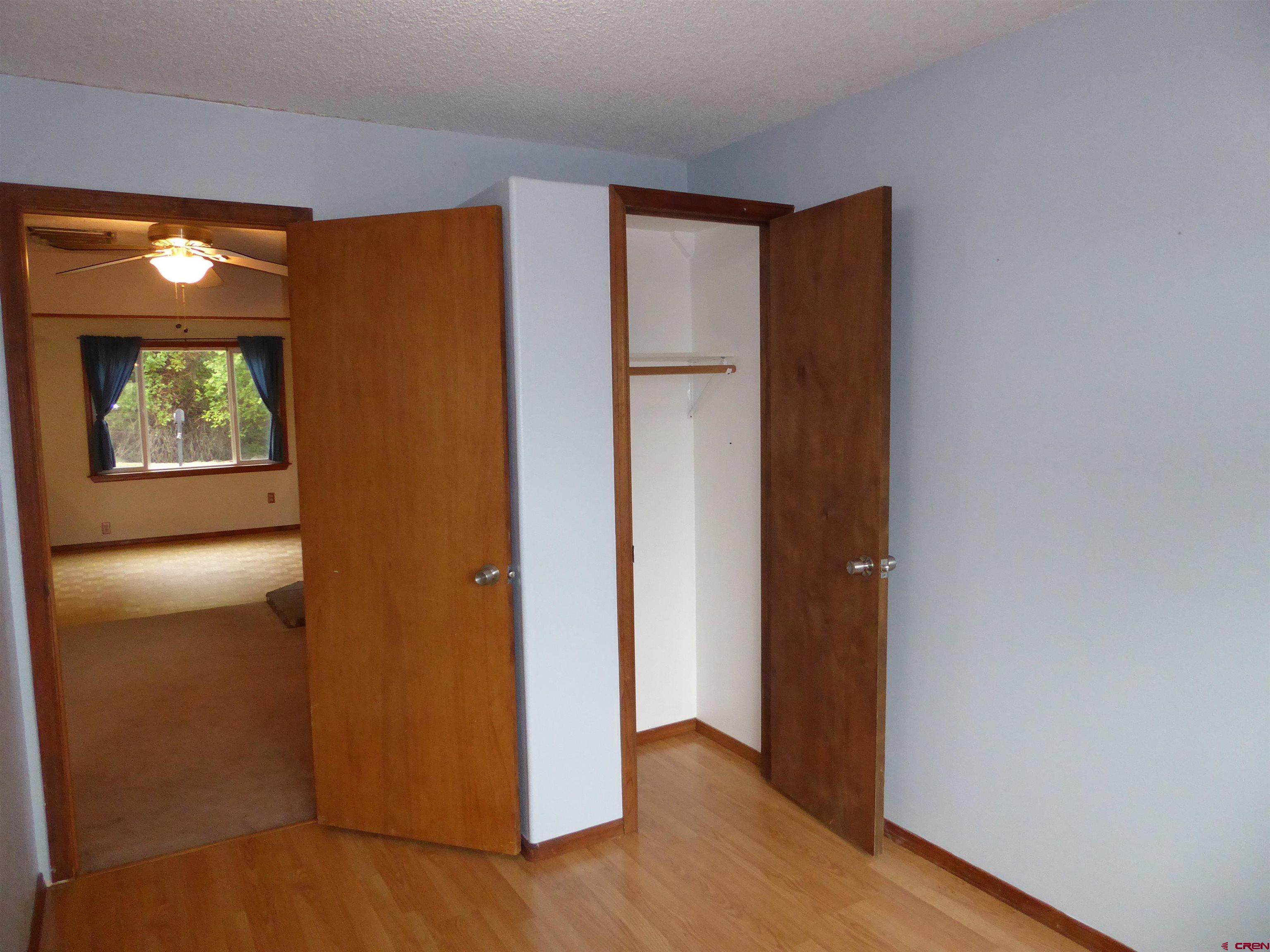 180 Northwest 7th Street Cedaredge, CO 81413 - Photo 38 of 44 a view of an empty room with wooden floor and a window
