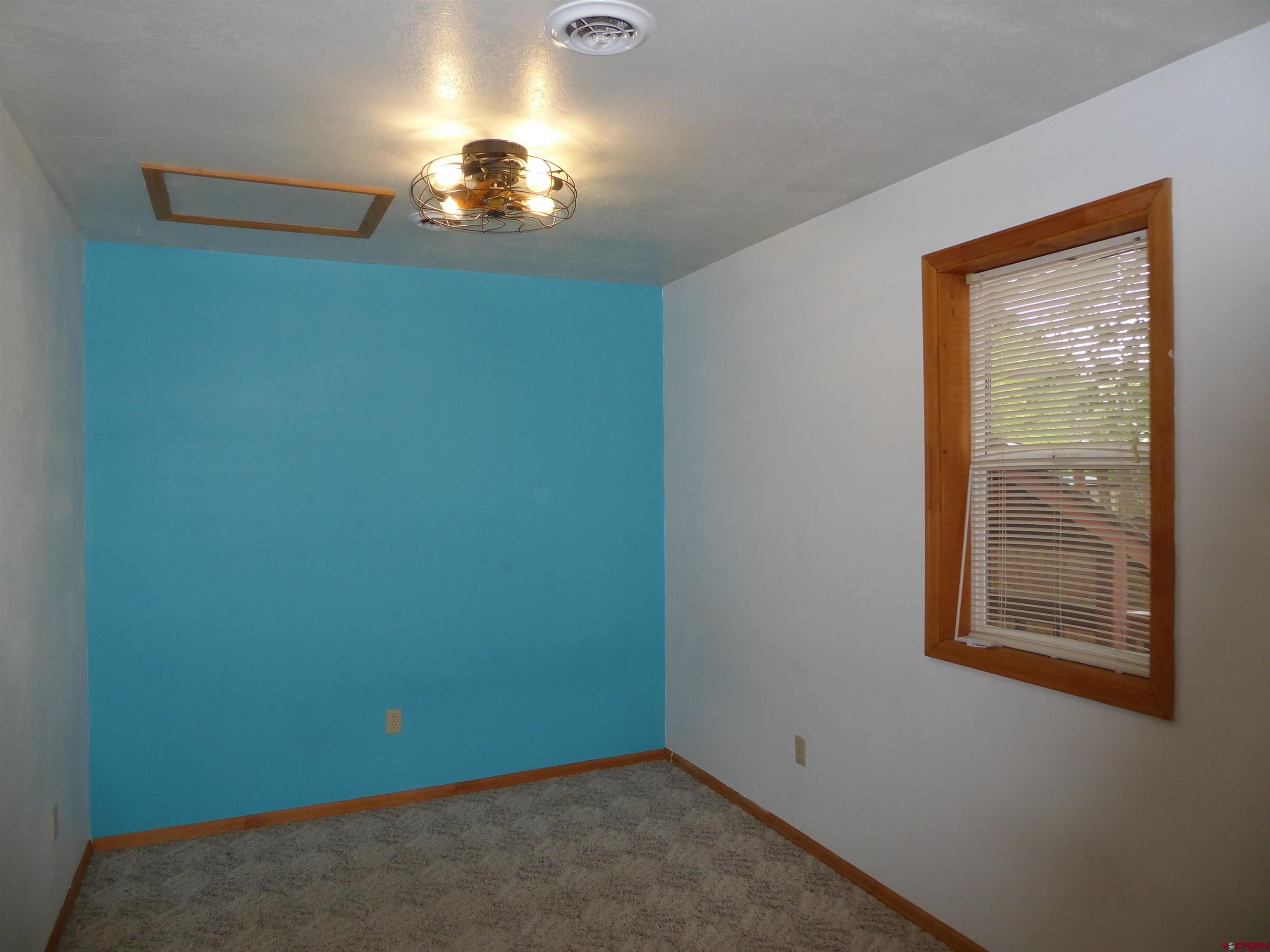 180 Northwest 7th Street Cedaredge, CO 81413 - Photo 40 of 44 an empty room with a window