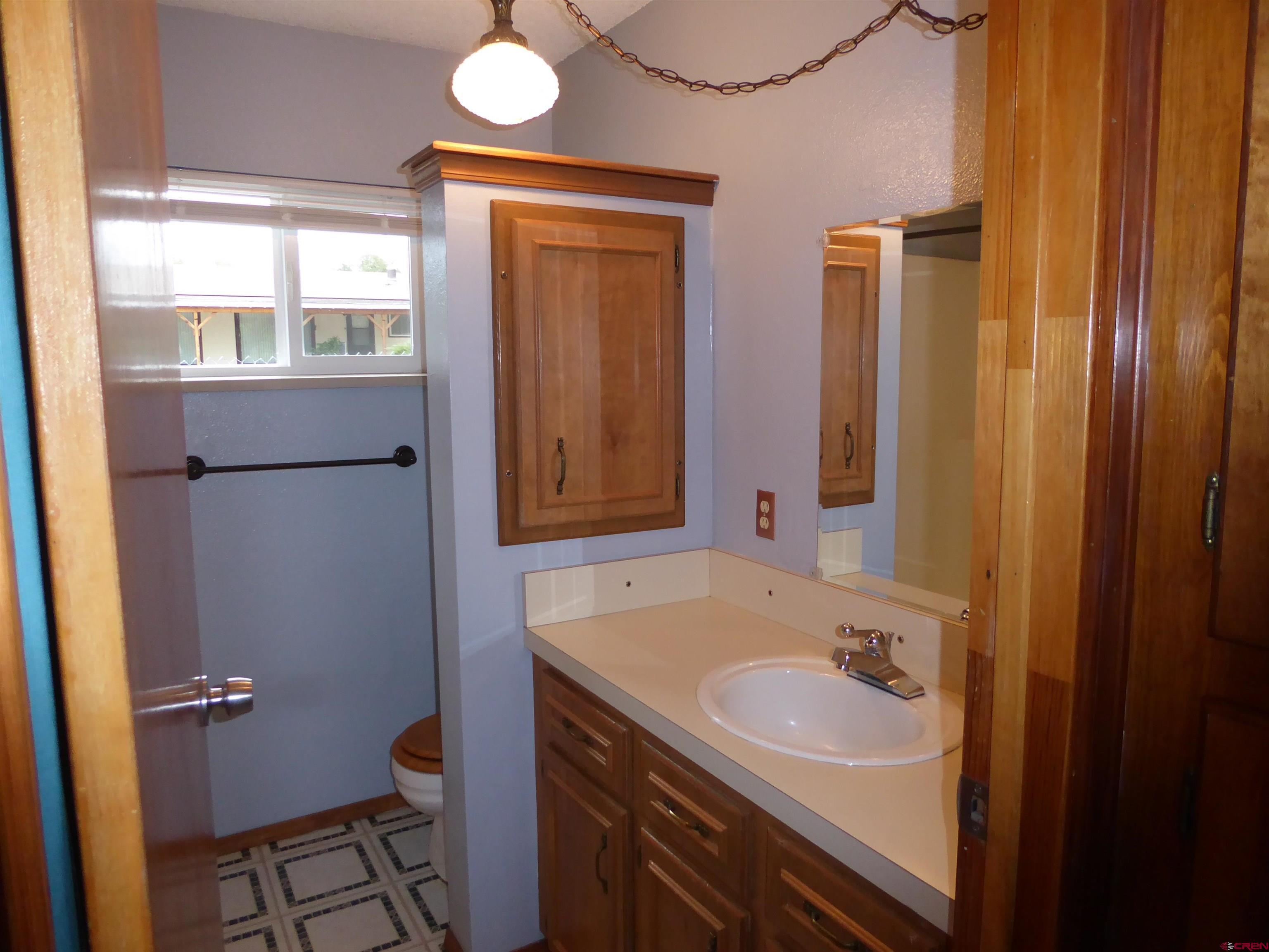 180 Northwest 7th Street Cedaredge, CO 81413 - Photo 41 of 44 a bathroom with a sink and a mirror