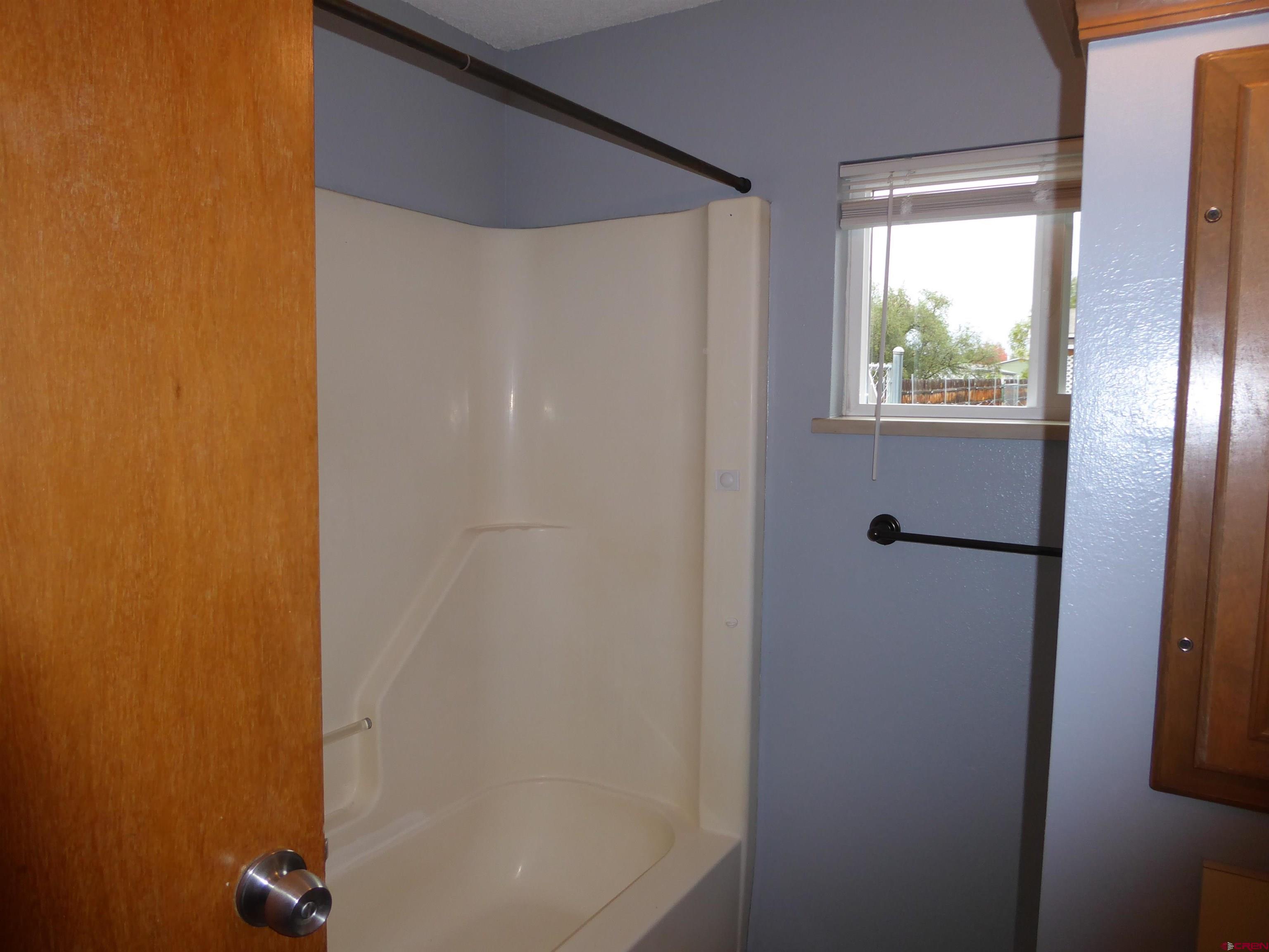 180 Northwest 7th Street Cedaredge, CO 81413 - Photo 42 of 44 a bathroom with a shower