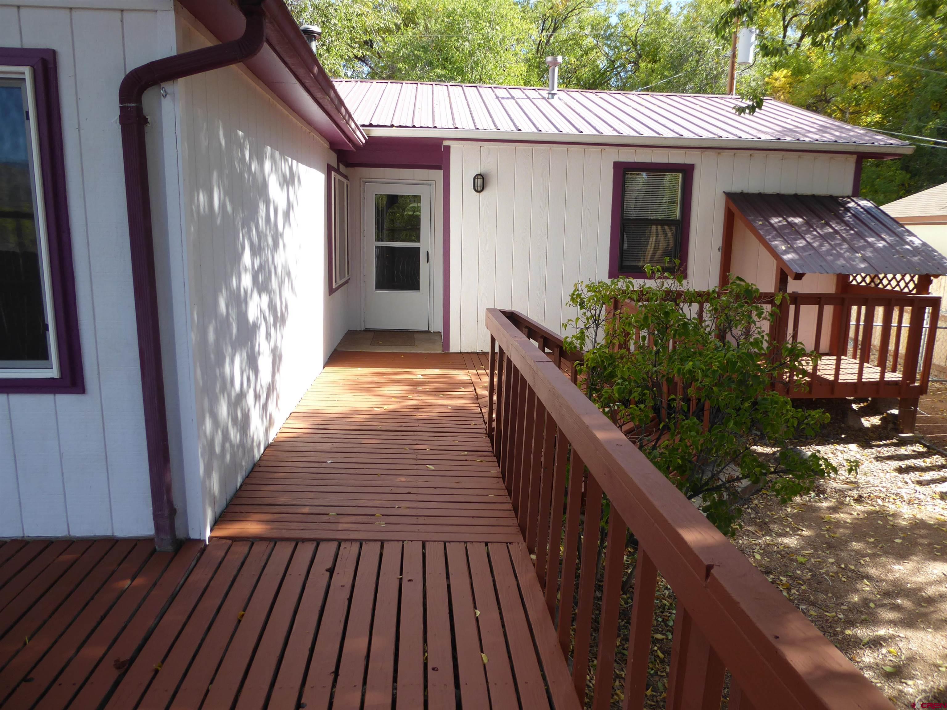 180 Northwest 7th Street Cedaredge, CO 81413 - Photo 5 of 44 a view of a house with backyard and wooden floor