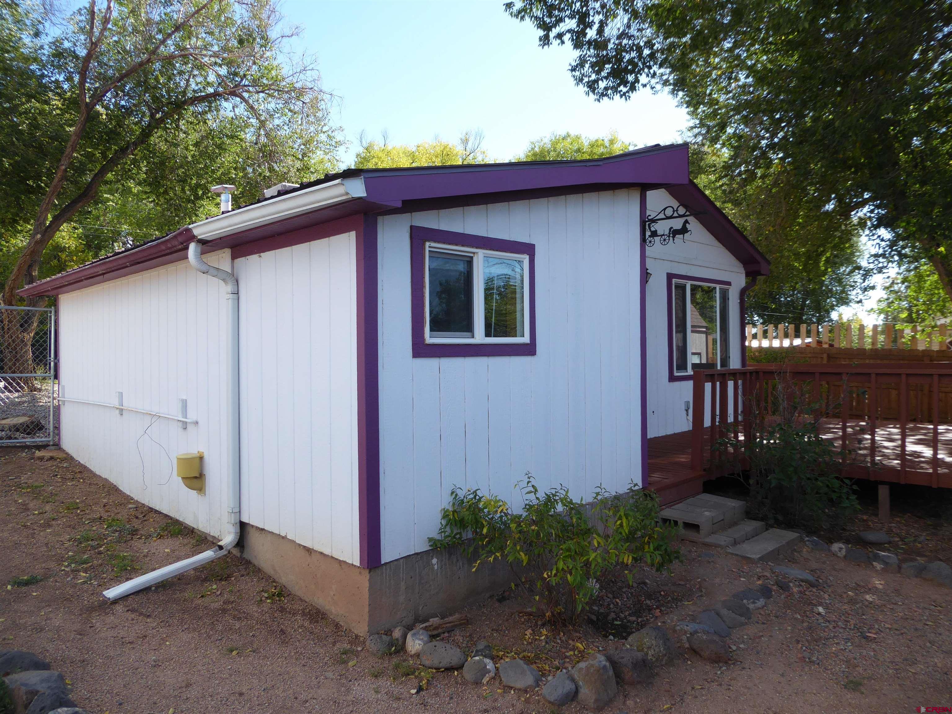 180 Northwest 7th Street Cedaredge, CO 81413 - Photo 9 of 44 a view of a house with a yard