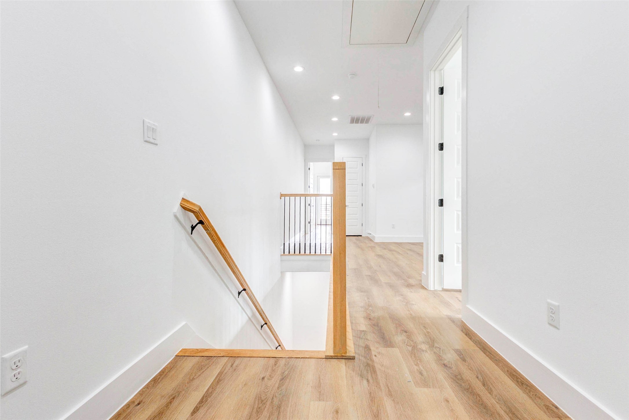 2118 Live Oak Street, Unit B Houston, TX 77003 - Photo 27 of 50 A clean, bright hallway with a simple layout and soft, even lighting throughout. The space feels open and uncluttered, offering an easy flow between rooms with a polished, modern feel.