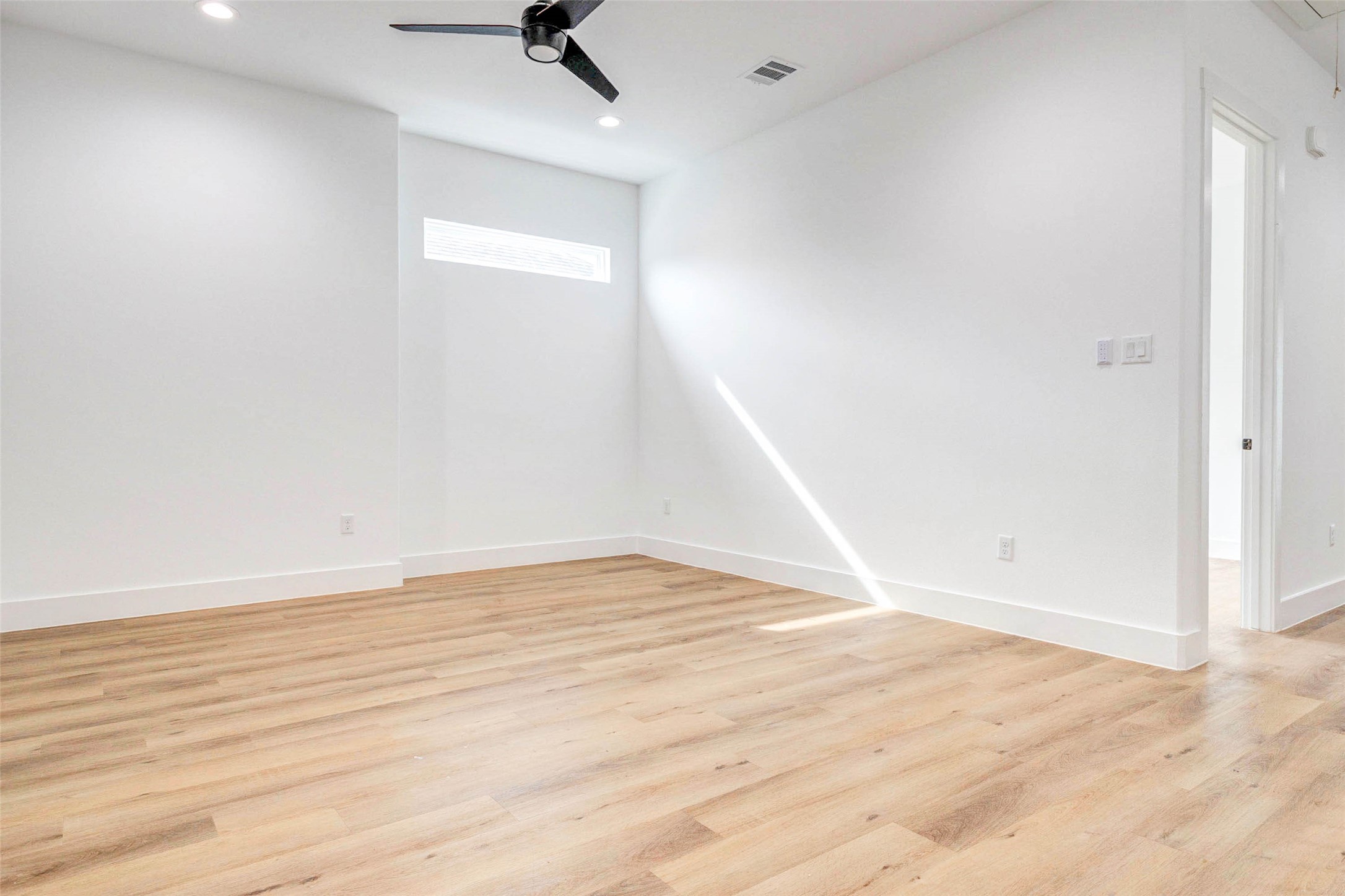 2118 Live Oak Street, Unit B Houston, TX 77003 - Photo 29 of 50 A flexible game room with a bright, open layout and plenty of space to spread out. Clean lines and natural light make it an easy spot for entertainment, hobbies, or a casual lounge setup.