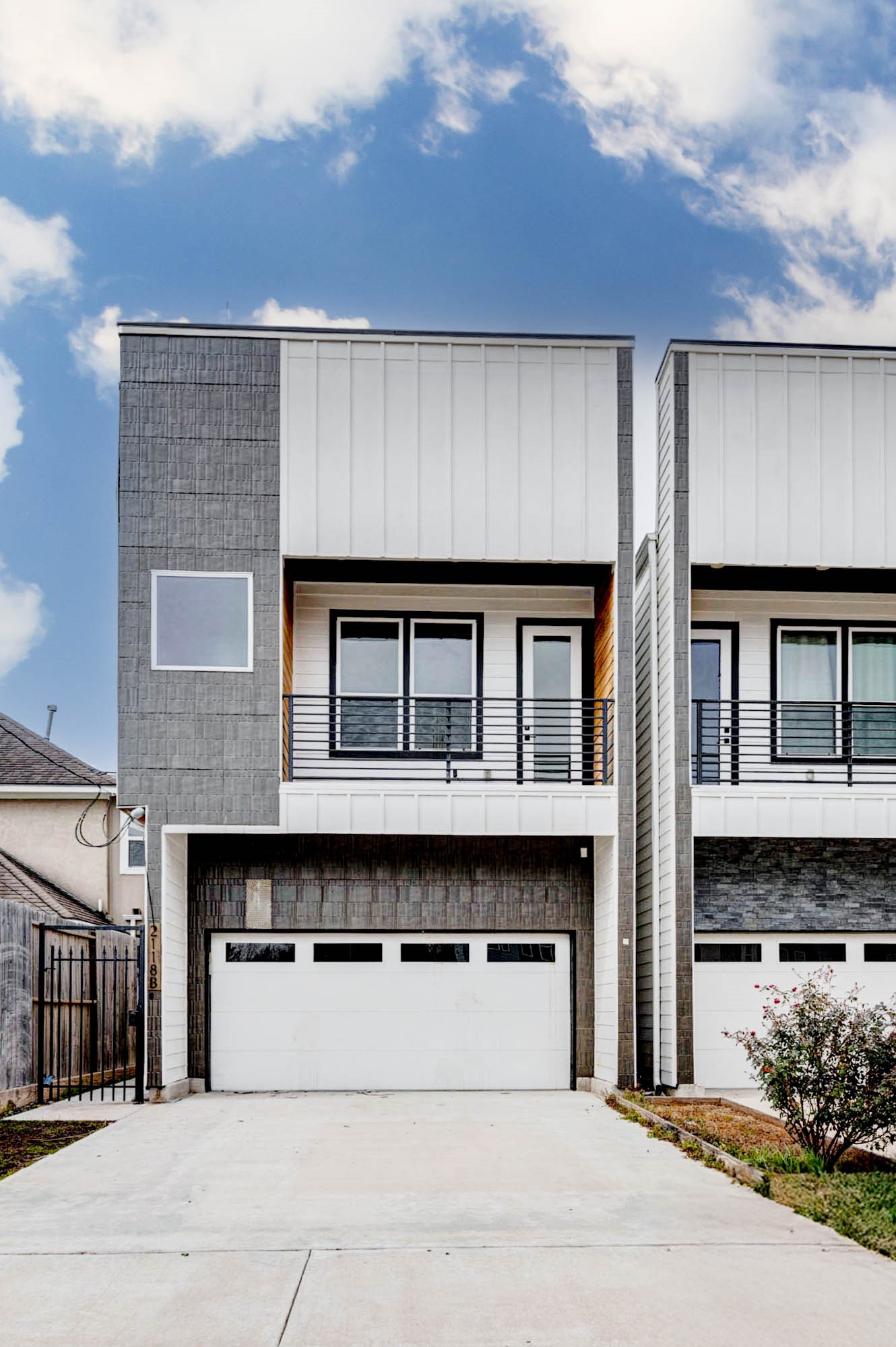 2118 Live Oak Street, Unit B Houston, TX 77003 - Photo 3 of 50 A striking modern exterior blends clean architectural lines with layered textures and a private balcony for a polished street presence. The design feels intentional and refined, offering a quiet sense of style without trying too hard.