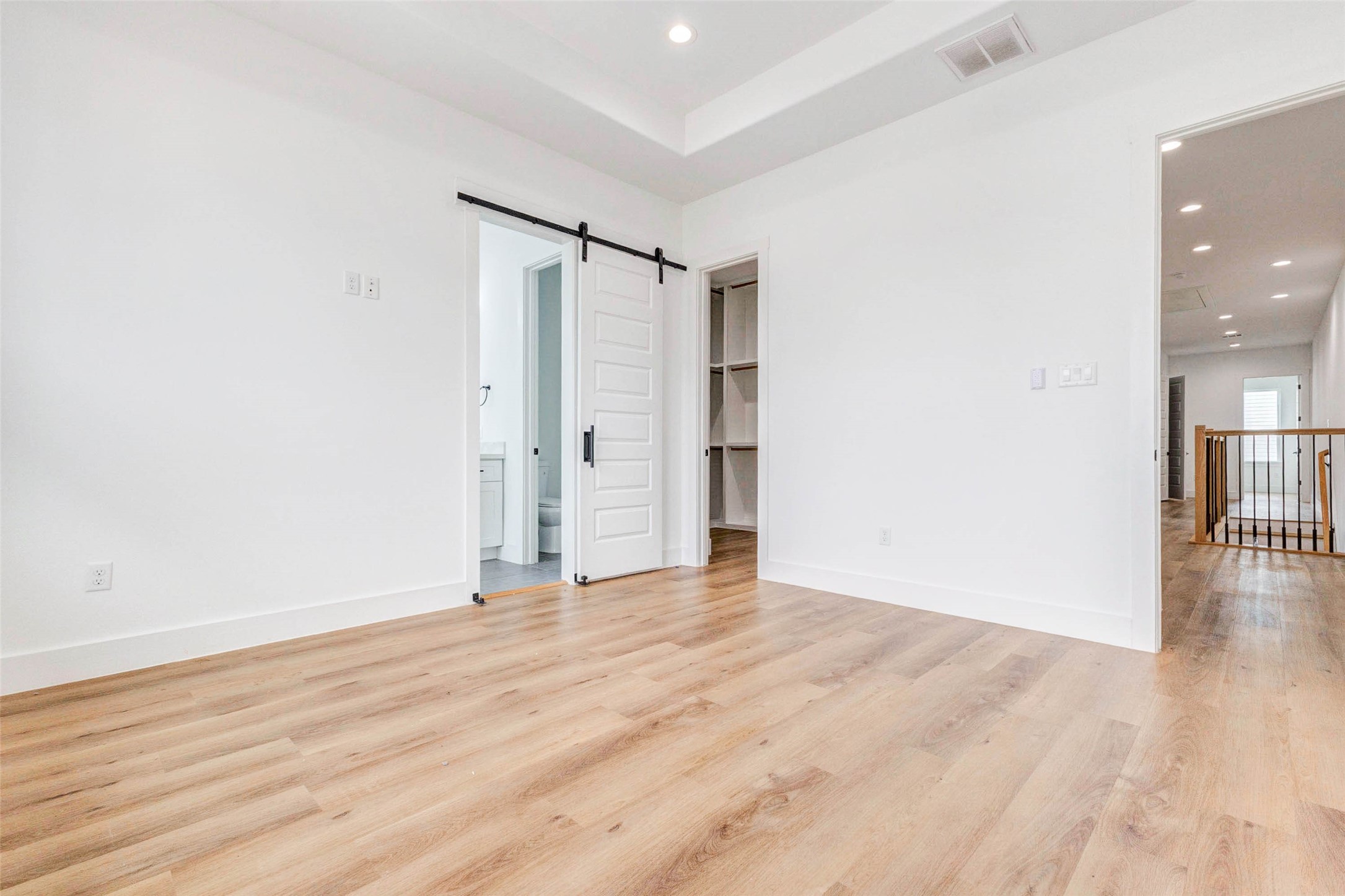 2118 Live Oak Street, Unit B Houston, TX 77003 - Photo 32 of 50 A spacious primary bedroom with a calm, open layout and a private bath just off the room. Clean lines and natural light create a comfortable retreat that feels both relaxed and refined.