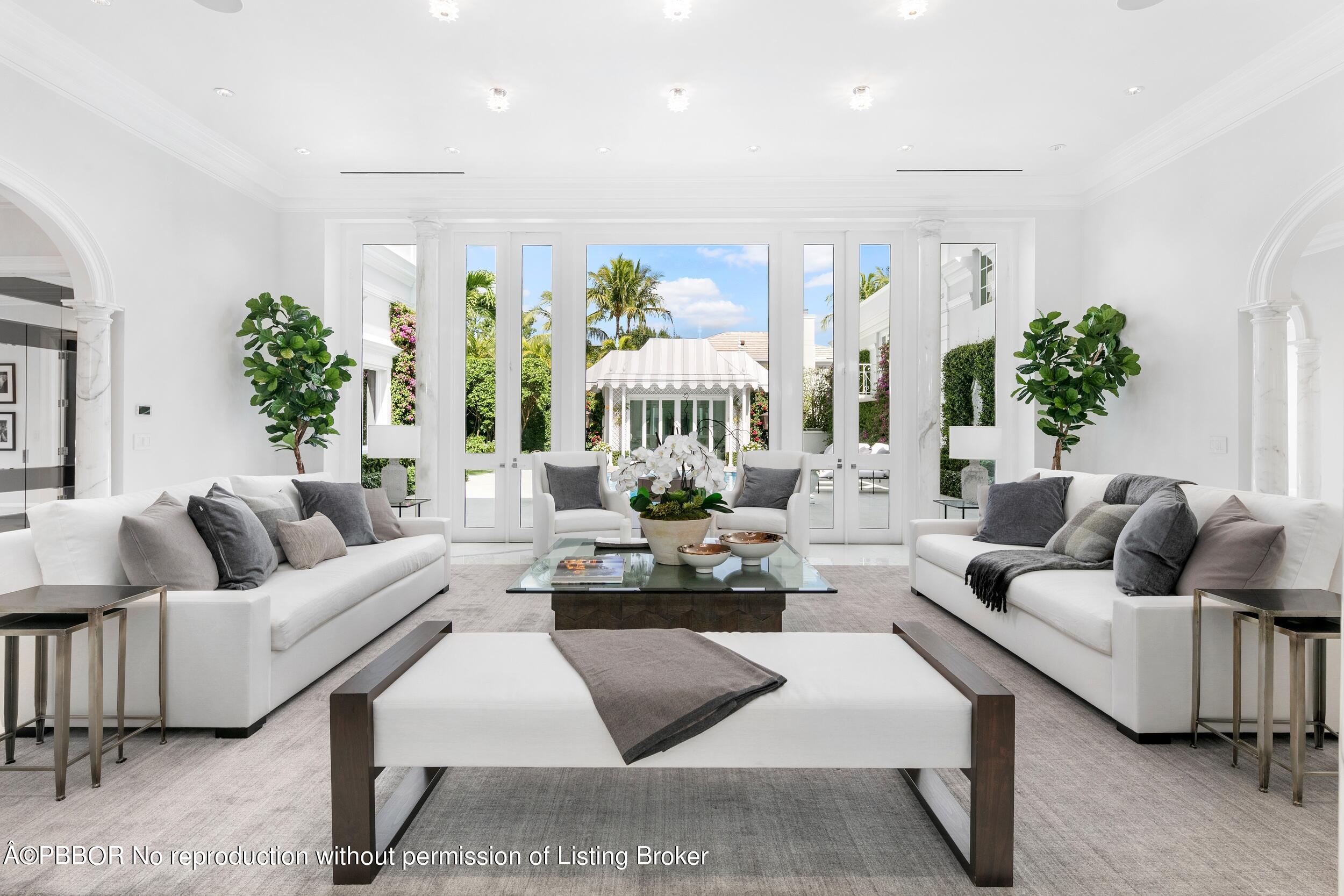 301 Polmer Park Road Palm Beach, FL 33480 - Photo 1 of 43 a living room with furniture kitchen view and a potted plant