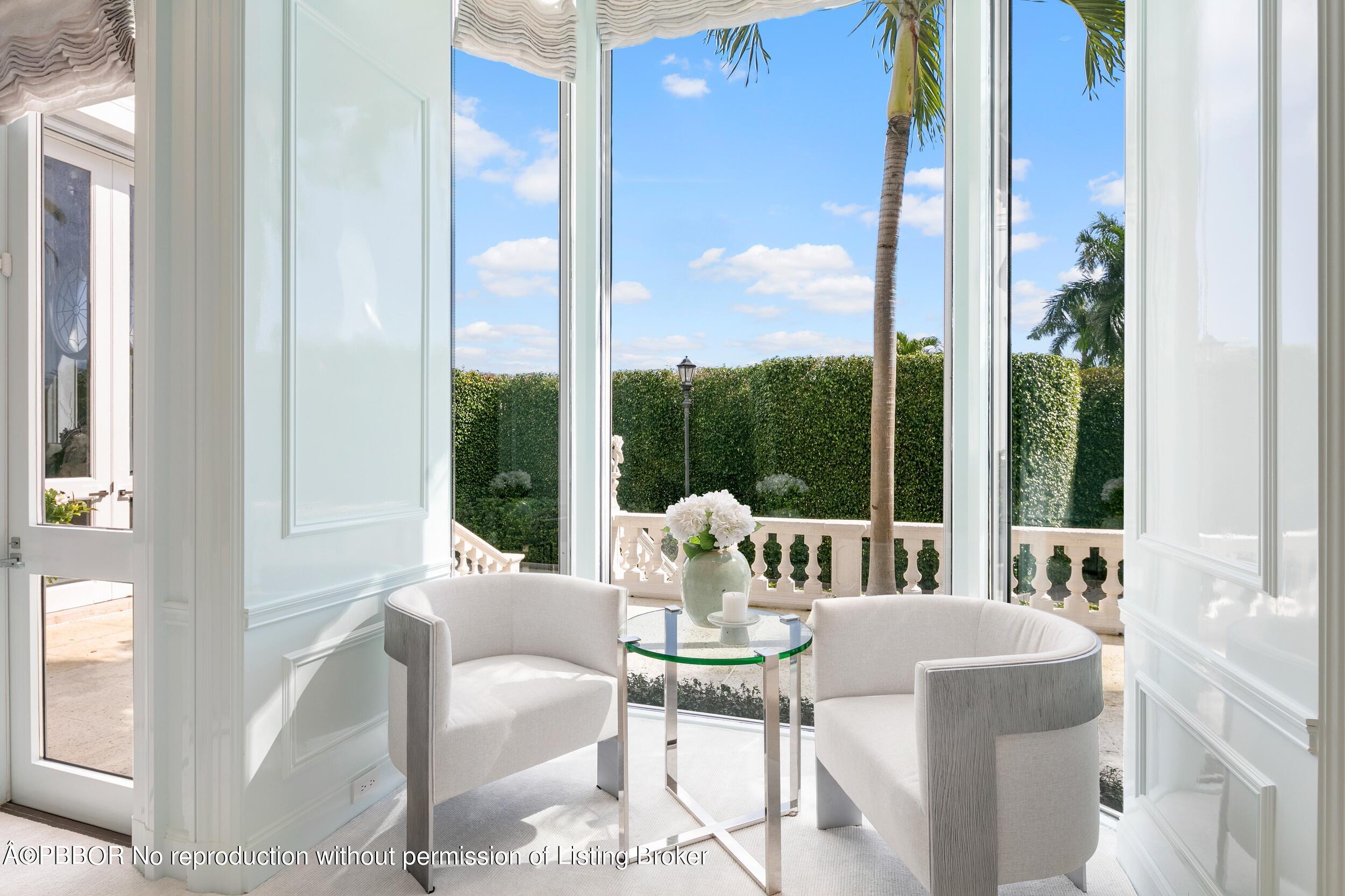 301 Polmer Park Road Palm Beach, FL 33480 - Photo 11 of 43 a living room with furniture and large windows