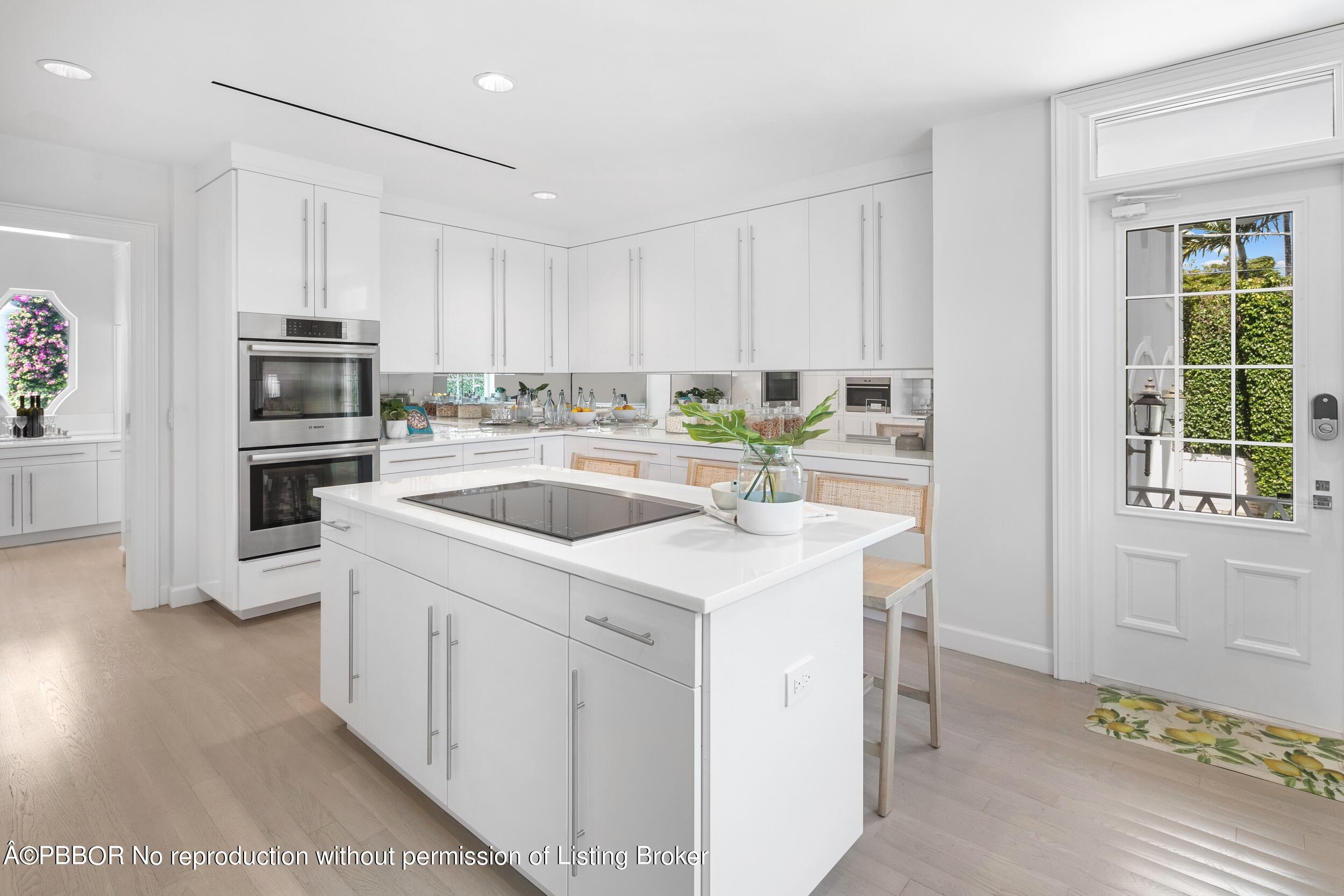 301 Polmer Park Road Palm Beach, FL 33480 - Photo 13 of 43 a kitchen that has a sink and a stove in it