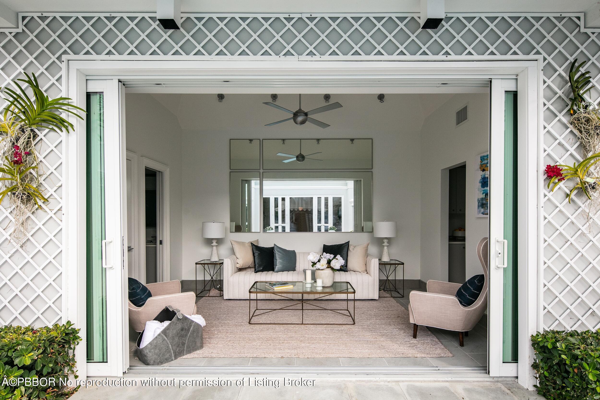 301 Polmer Park Road Palm Beach, FL 33480 - Photo 20 of 43 a living room with furniture and a fireplace