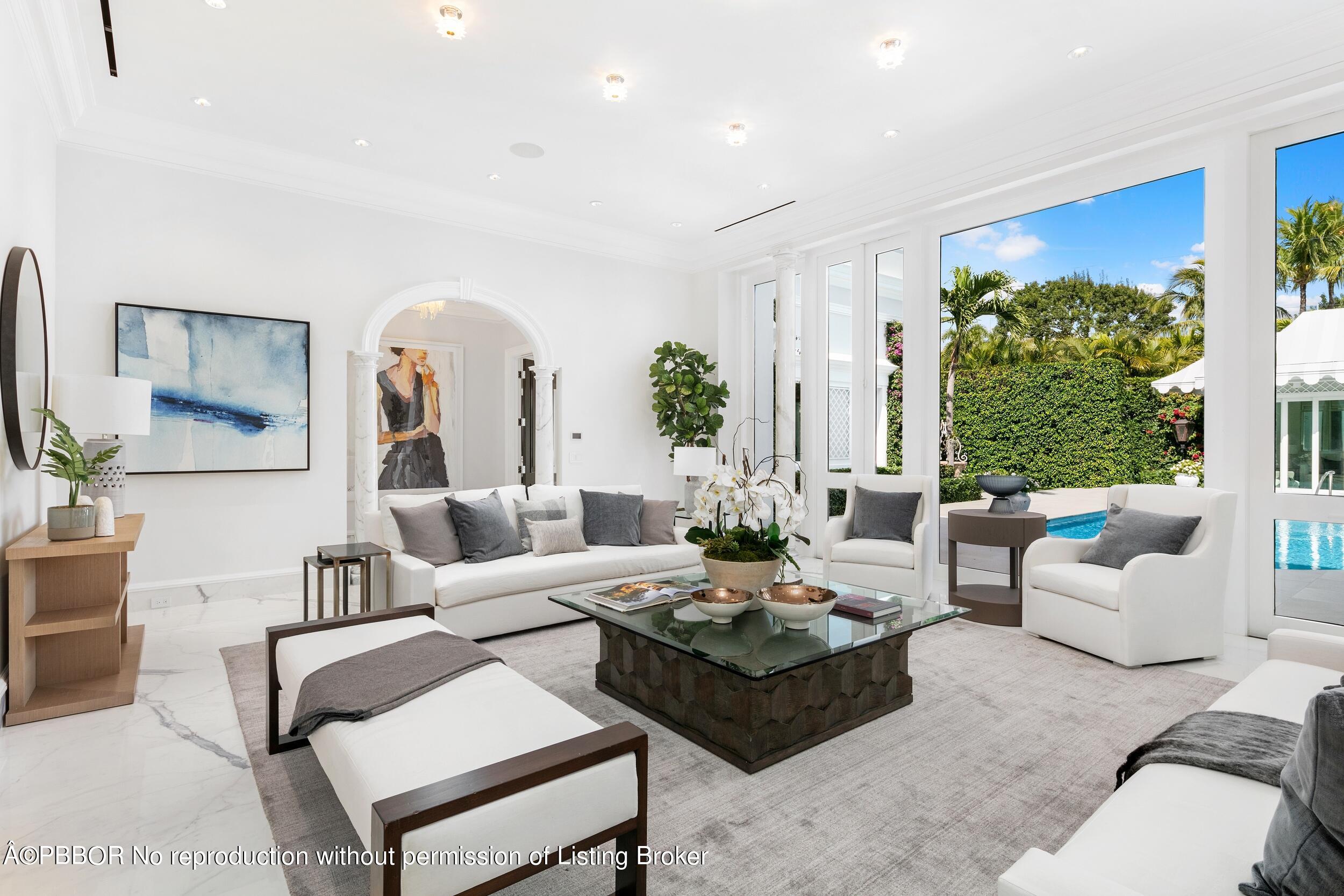 301 Polmer Park Road Palm Beach, FL 33480 - Photo 2 of 43 a living room with furniture potted plant and a large window