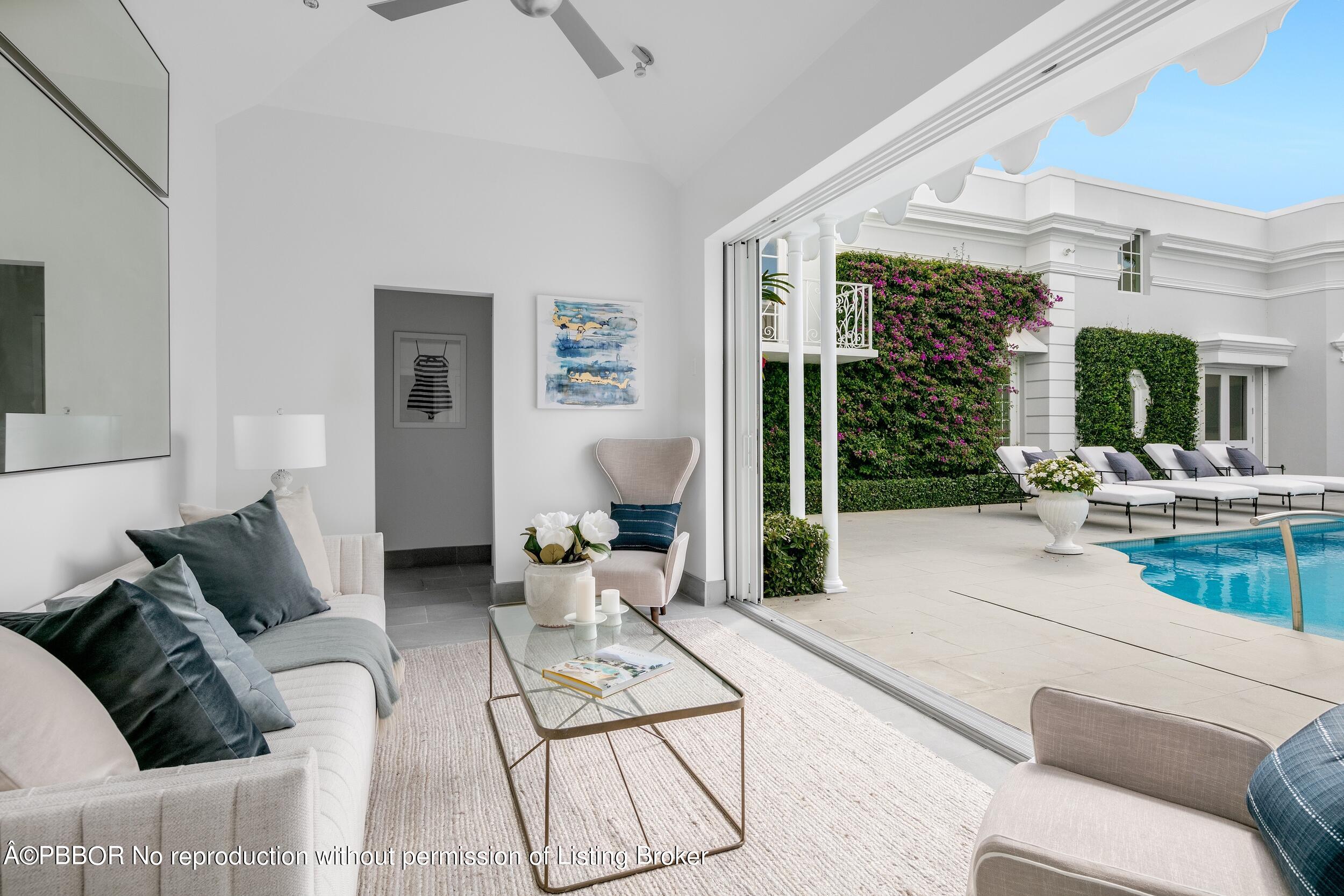 301 Polmer Park Road Palm Beach, FL 33480 - Photo 21 of 43 a living room with furniture and a large window