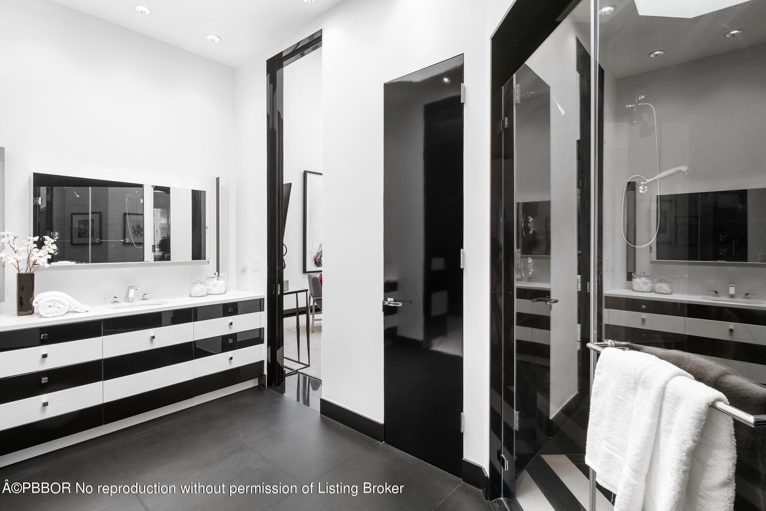 301 Polmer Park Road Palm Beach, FL 33480 - Photo 25 of 43 a bathroom with a bathtub and a double vanity sink