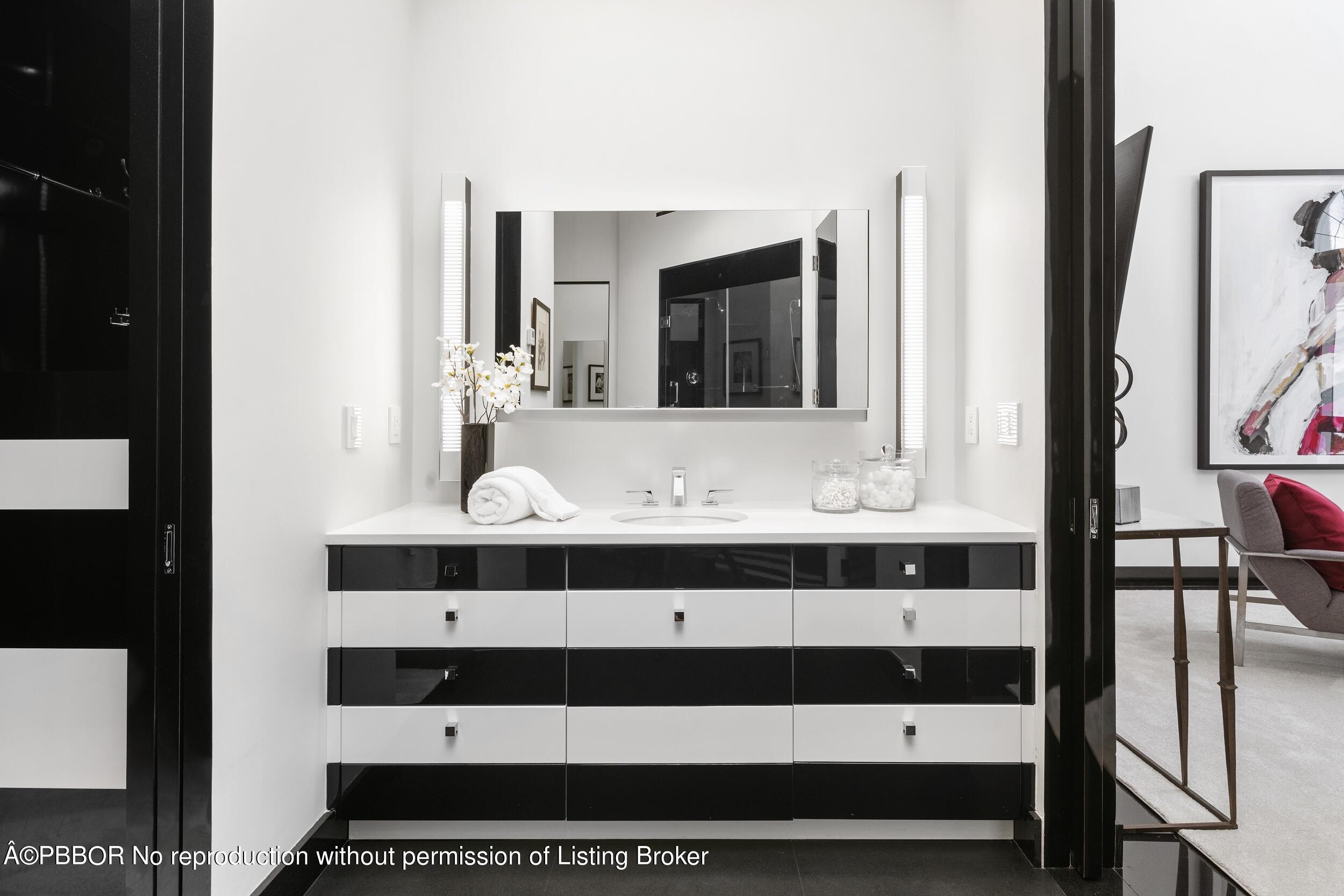 301 Polmer Park Road Palm Beach, FL 33480 - Photo 26 of 43 a bathroom with a sink and a mirror