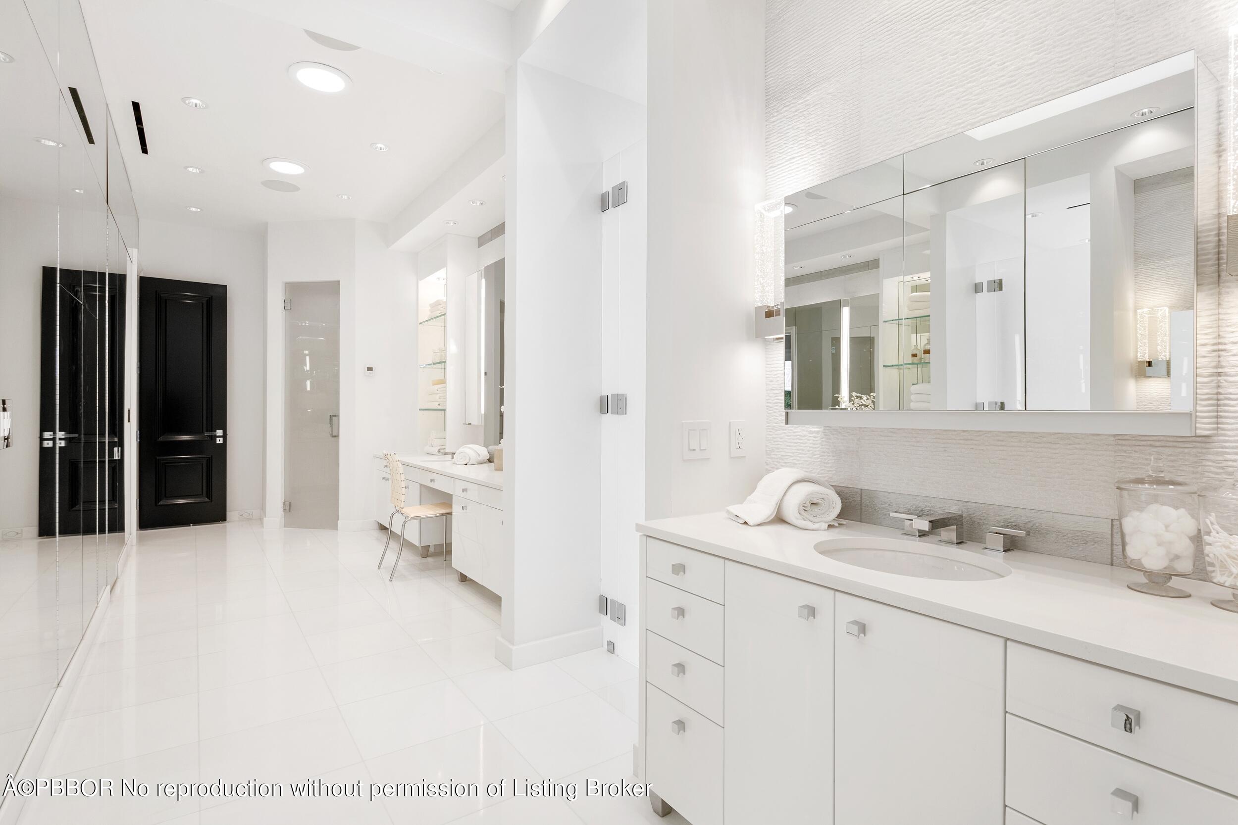 301 Polmer Park Road Palm Beach, FL 33480 - Photo 28 of 43 a spacious bathroom with a sink and a mirror