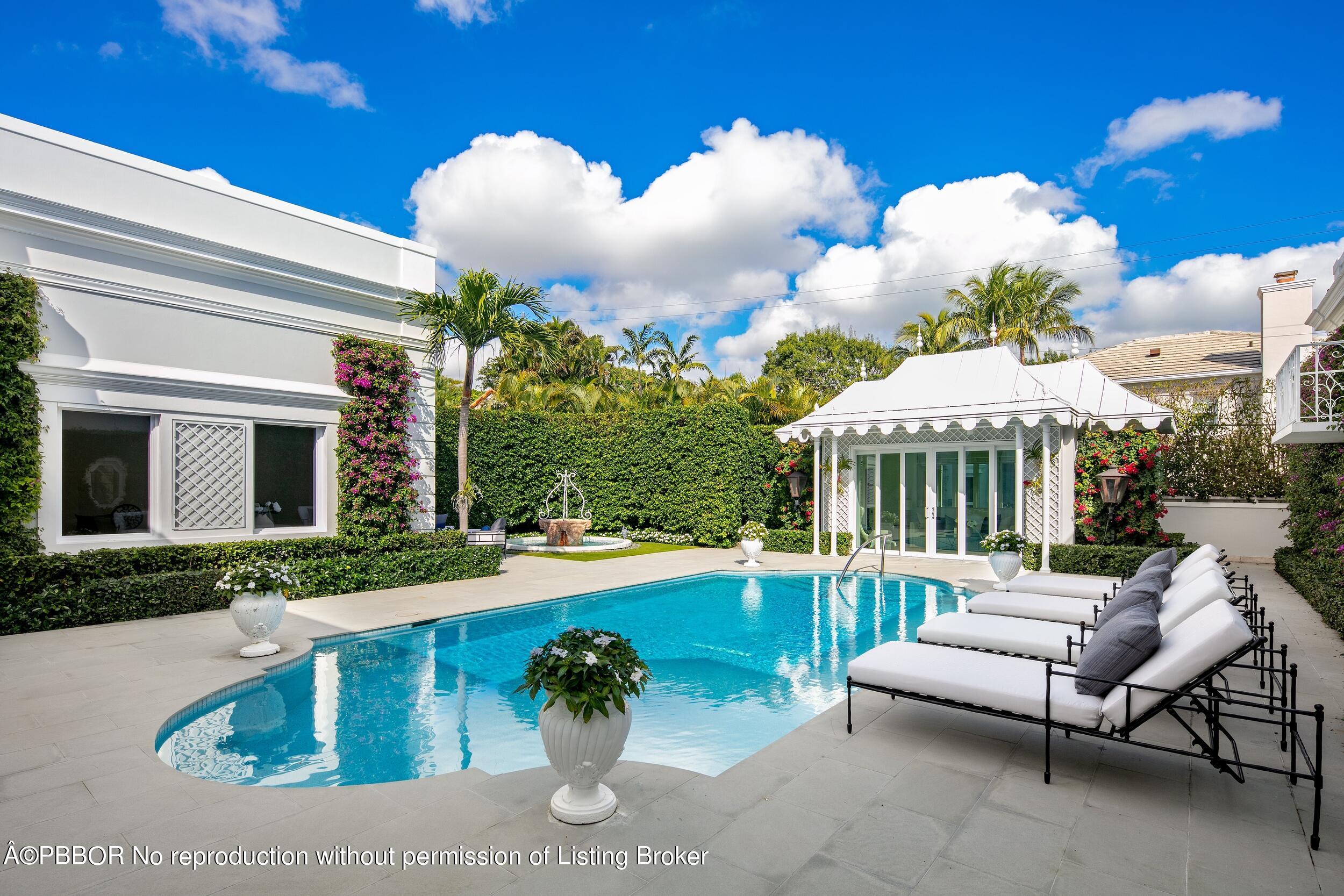 301 Polmer Park Road Palm Beach, FL 33480 - Photo 33 of 43 a view of a house with backyard and sitting area