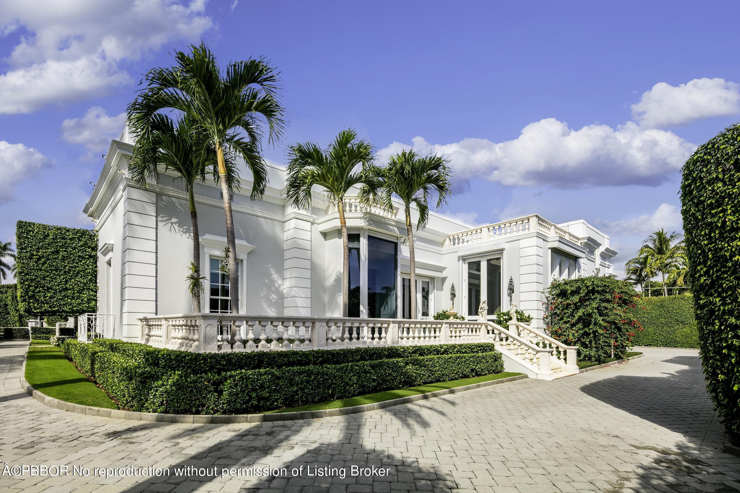 301 Polmer Park Road Palm Beach, FL 33480 - Photo 36 of 43 a front view of a house with a garden and a yard
