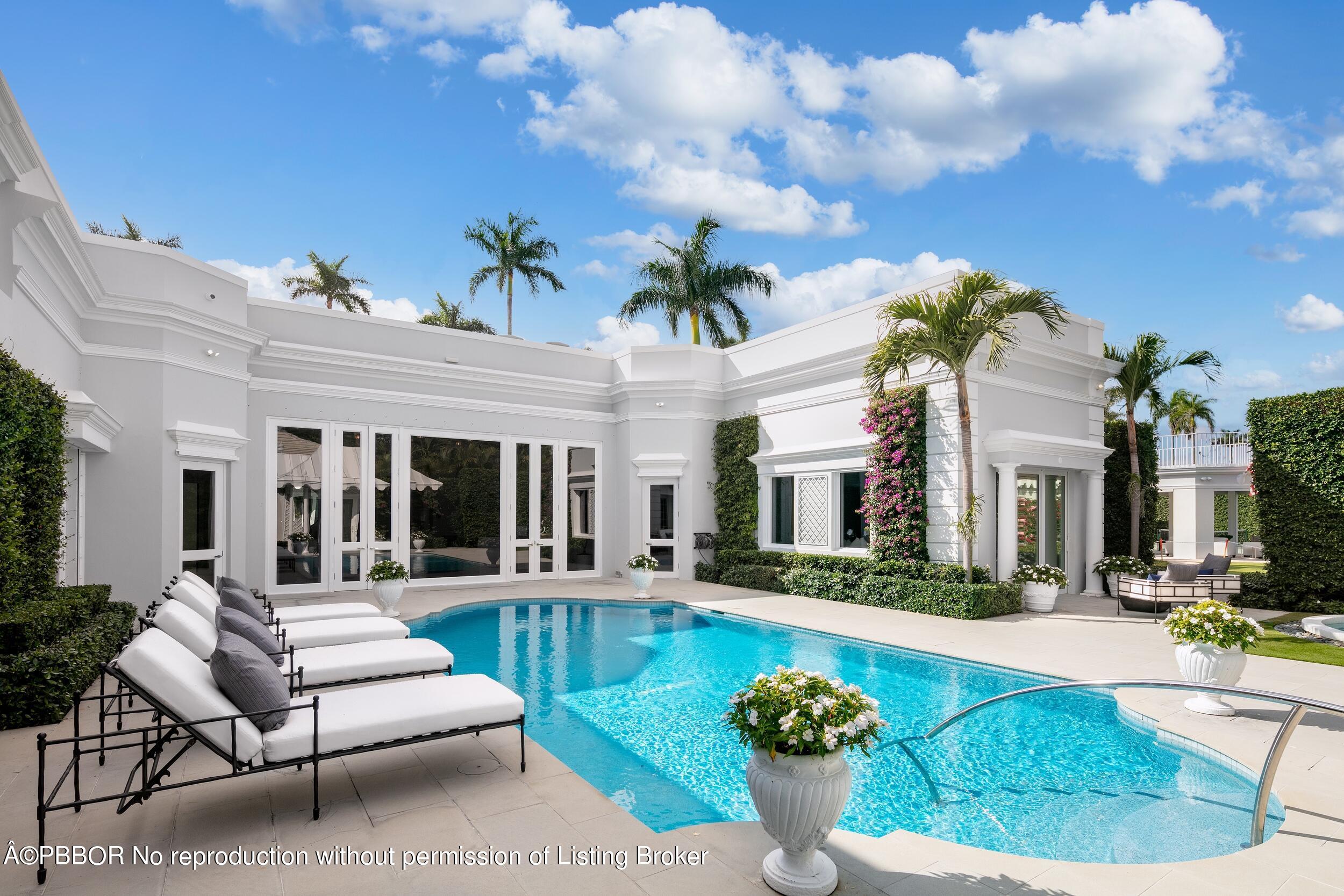 301 Polmer Park Road Palm Beach, FL 33480 - Photo 37 of 43 a view of a house with swimming pool and furniture