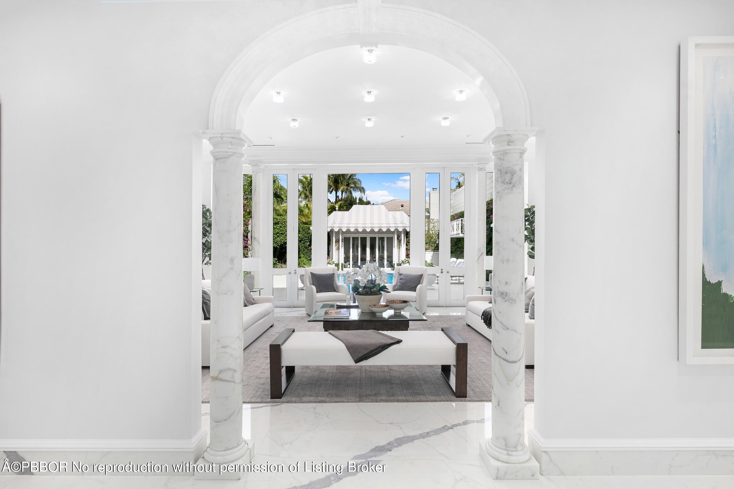 301 Polmer Park Road Palm Beach, FL 33480 - Photo 4 of 43 a living room with furniture and a chandelier