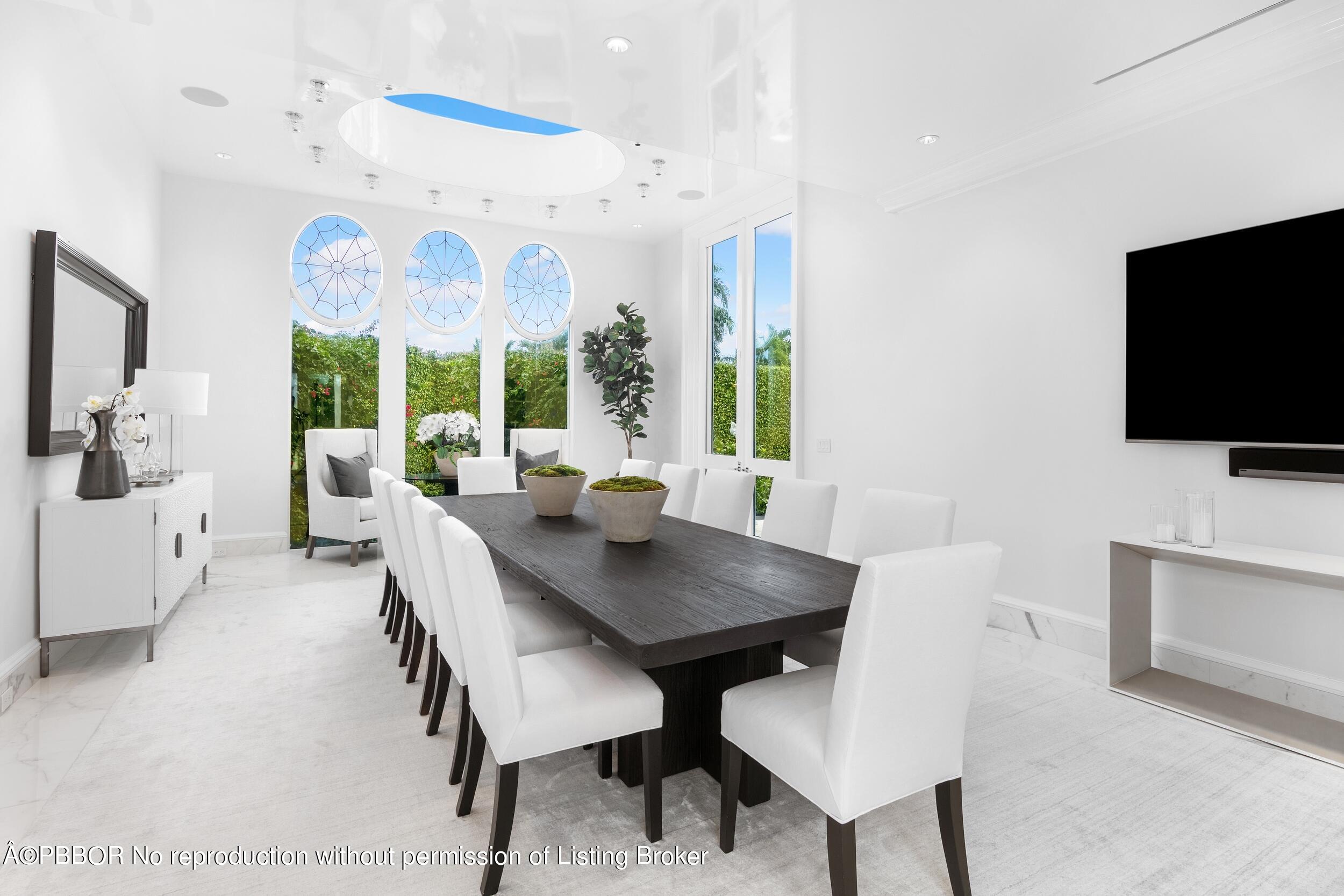 301 Polmer Park Road Palm Beach, FL 33480 - Photo 7 of 43 a view of a dining room with furniture and a large window
