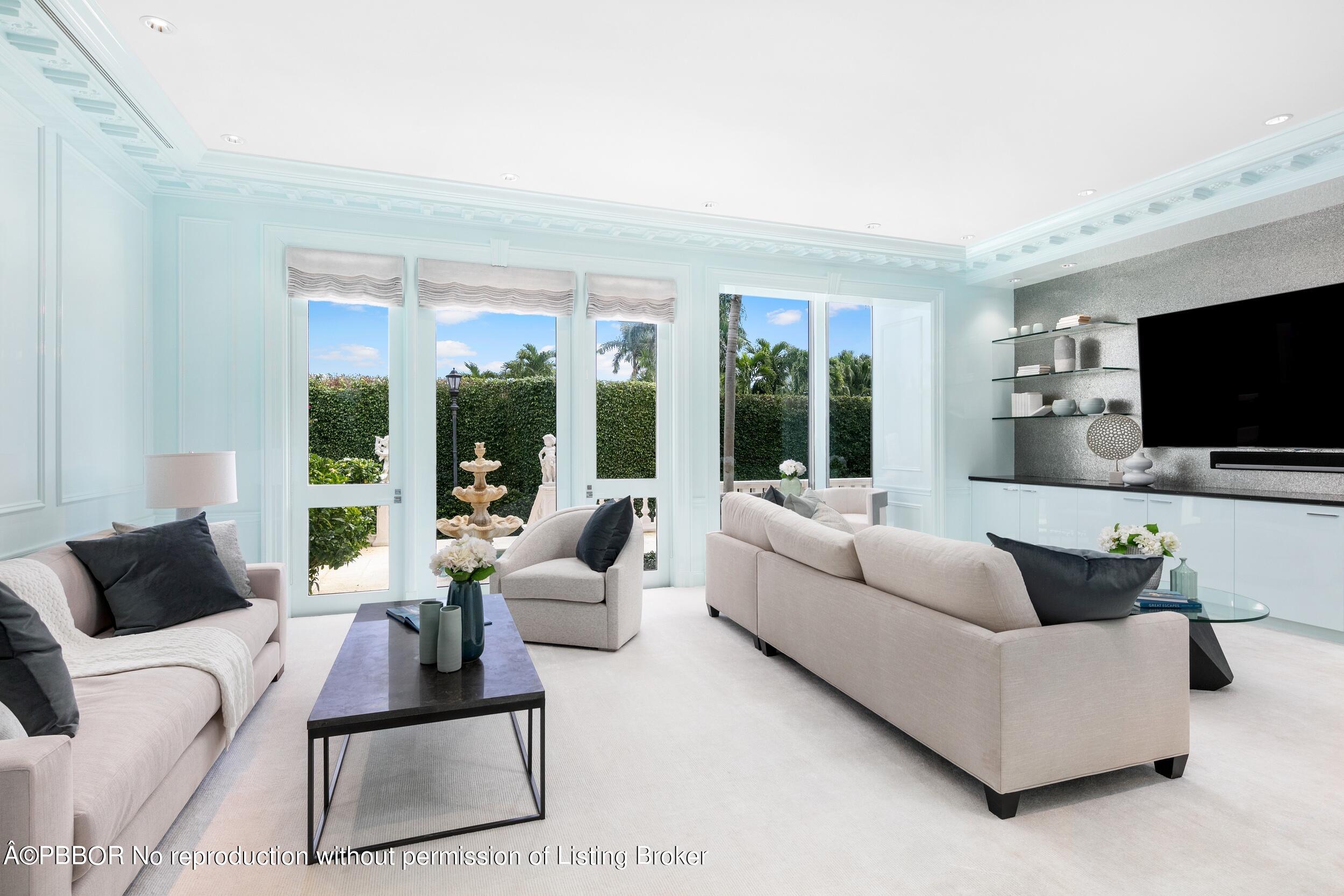 301 Polmer Park Road Palm Beach, FL 33480 - Photo 10 of 43 a living room with furniture and a flat screen tv