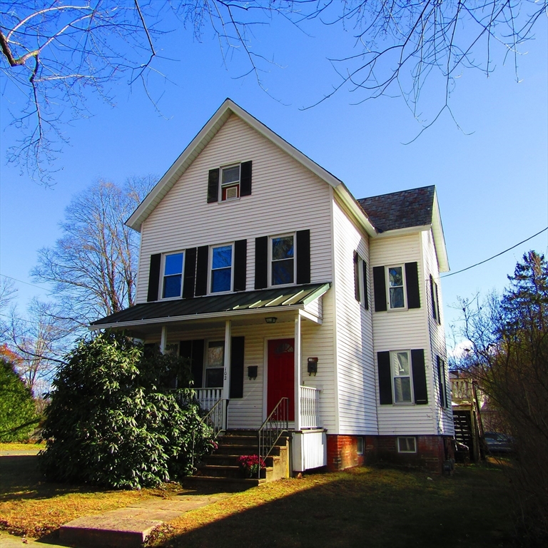 102 Vernon Street, Unit 2 Northampton, MA 01060 - Photo 1 of 7 a front view of a house with a yard