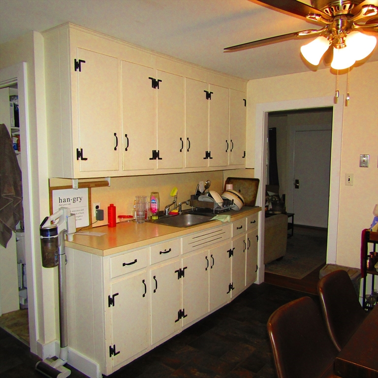 102 Vernon Street, Unit 2 Northampton, MA 01060 - Photo 4 of 7 a view of a kitchen with furniture and wooden floor