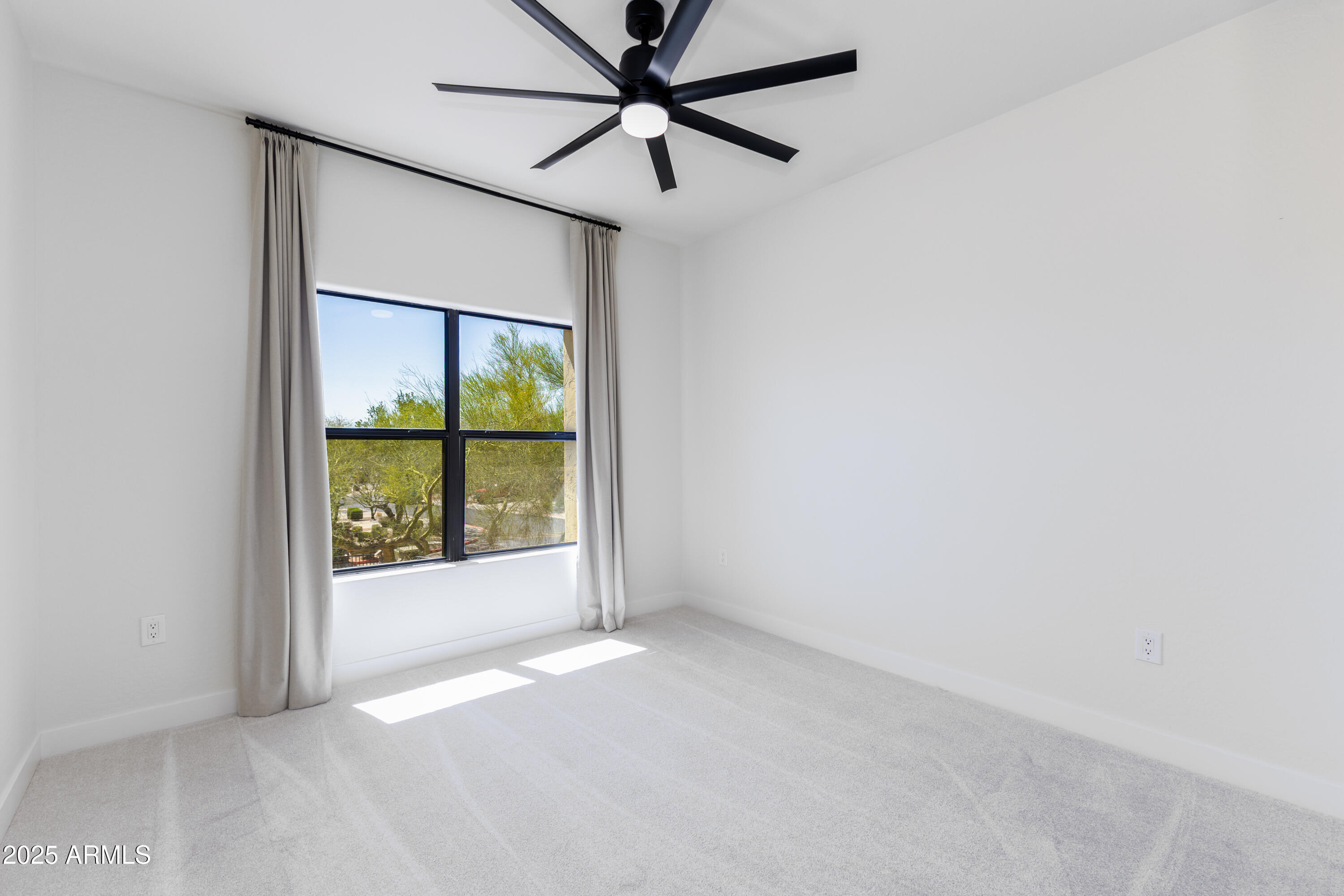 21320 North 56th Street, Unit 2001 Phoenix, AZ 85054 - Photo 15 of 45 an empty room with a window