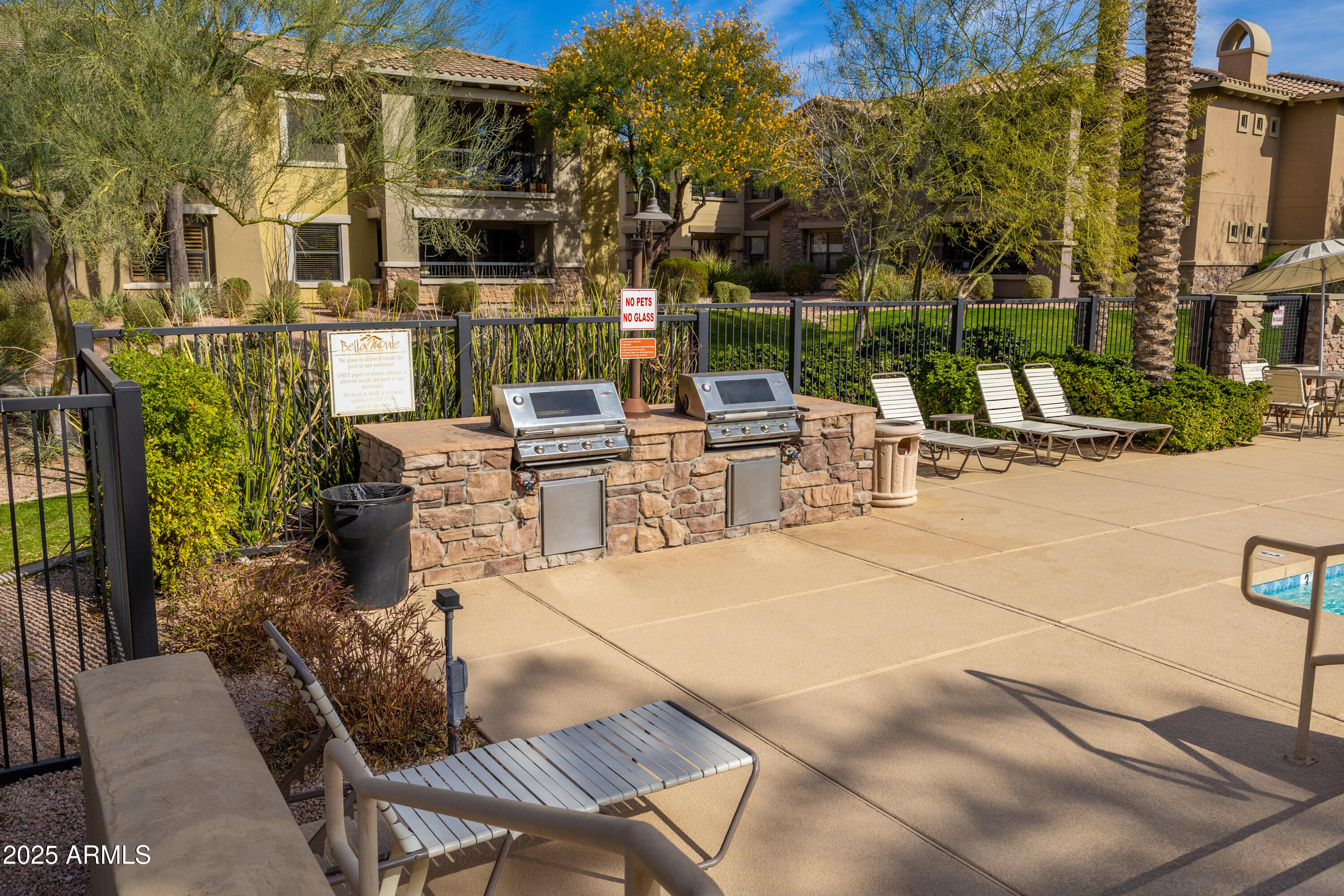 21320 North 56th Street, Unit 2001 Phoenix, AZ 85054 - Photo 26 of 45 a view of a patio with couches table and chairs and potted plants