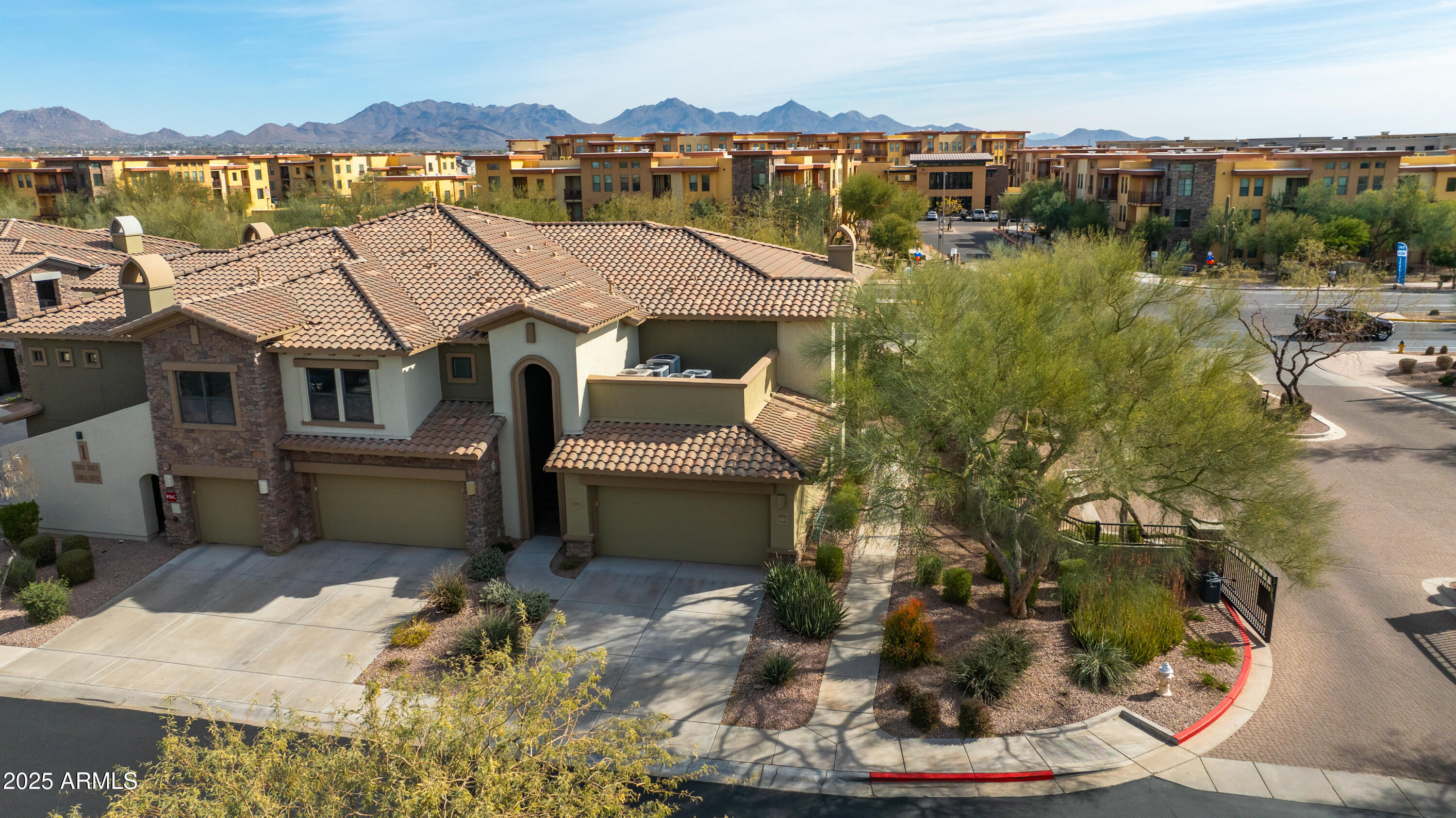 21320 North 56th Street, Unit 2001 Phoenix, AZ 85054 - Photo 30 of 45 a aerial view of a house with a yard