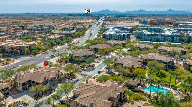 an aerial view of residential houses with outdoor space